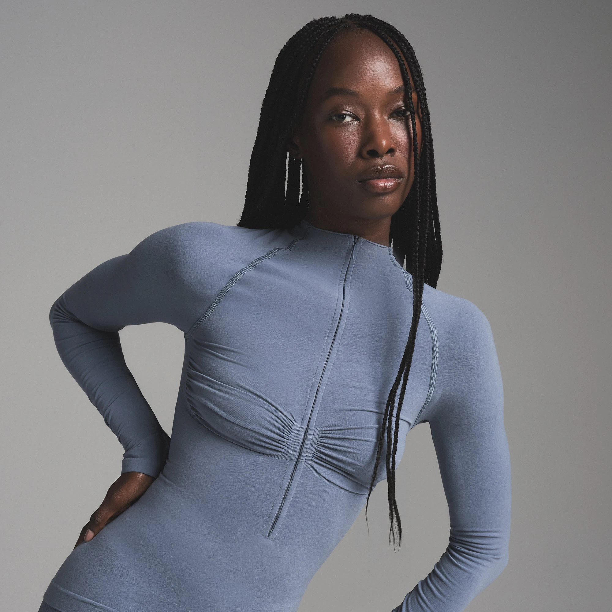 SEAMLESS SCULPT MOCK NECK LONG SLEEVE T-SHIRT | STEEL BLUE ON A MODEL SIDE VIEW | FOCUS: 0.0, 1.0, 0.9