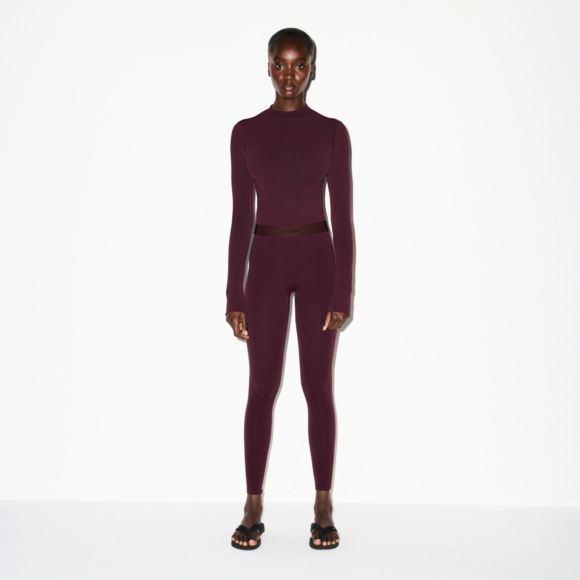 NikeSKIMS VINTAGE SEAMLESS MOCK NECK CROP TOP | CURRANT ON A MODEL FRONT VIEW @ | FOCUS: 0.0, 1.0, 0.9