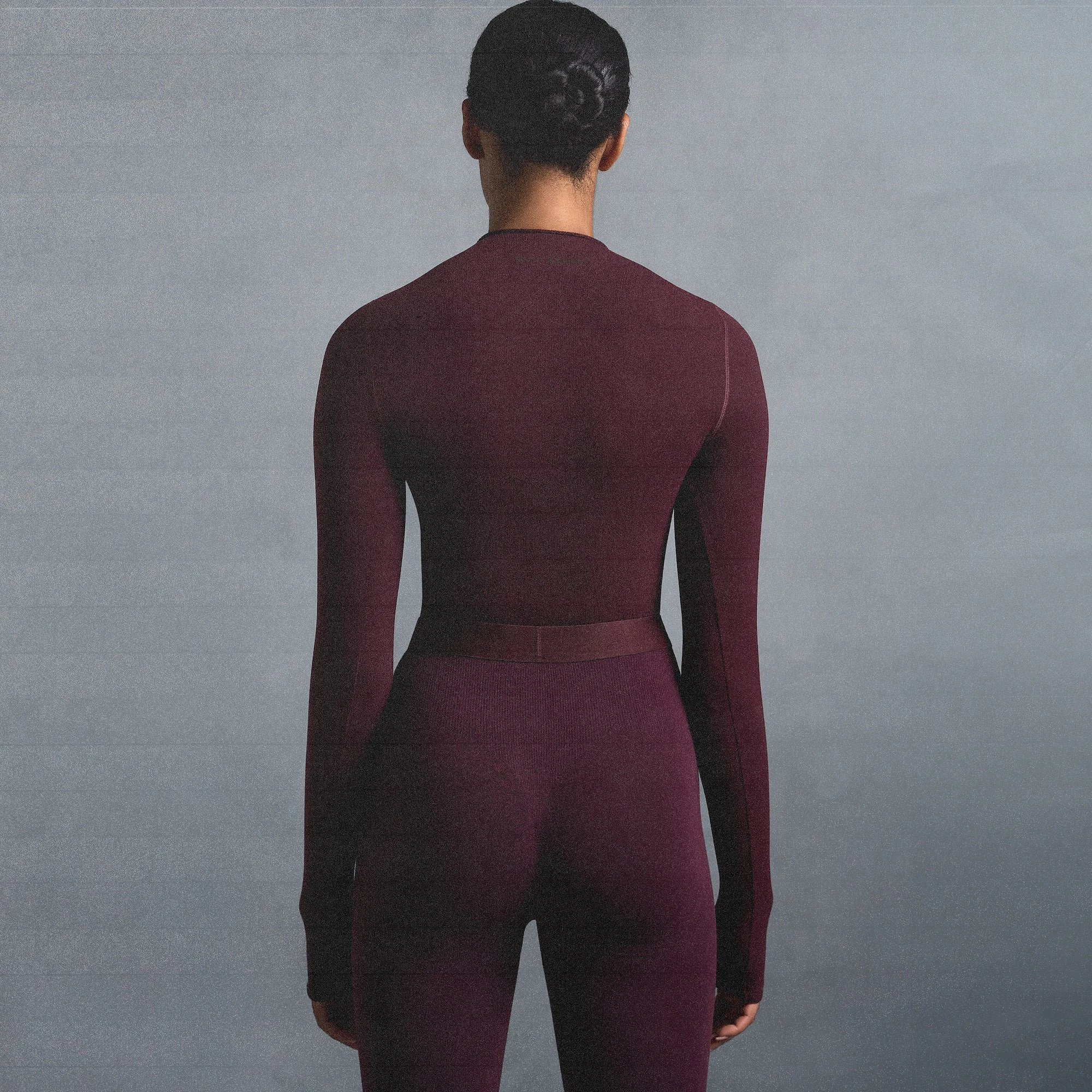 NikeSKIMS VINTAGE SEAMLESS MOCK NECK CROP TOP | CURRANT ON A MODEL SIDE VIEW @ | FOCUS: 0.0, 1.0, 0.9