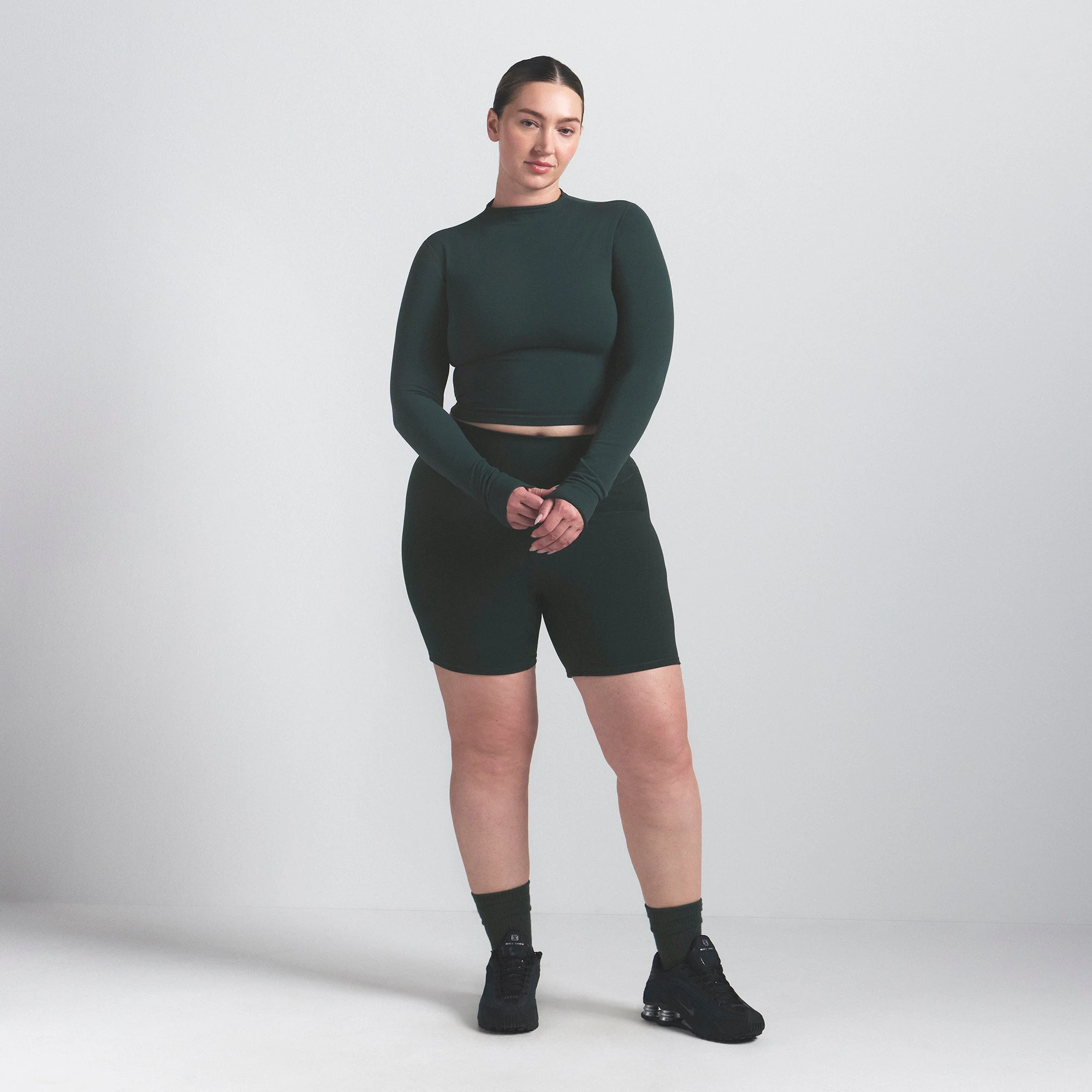 NikeSKIMS VINTAGE SEAMLESS MOCK NECK CROP TOP | DARK TEAL ON A MODEL FRONT VIEW @ | FOCUS: 0.0, 1.0, 0.9