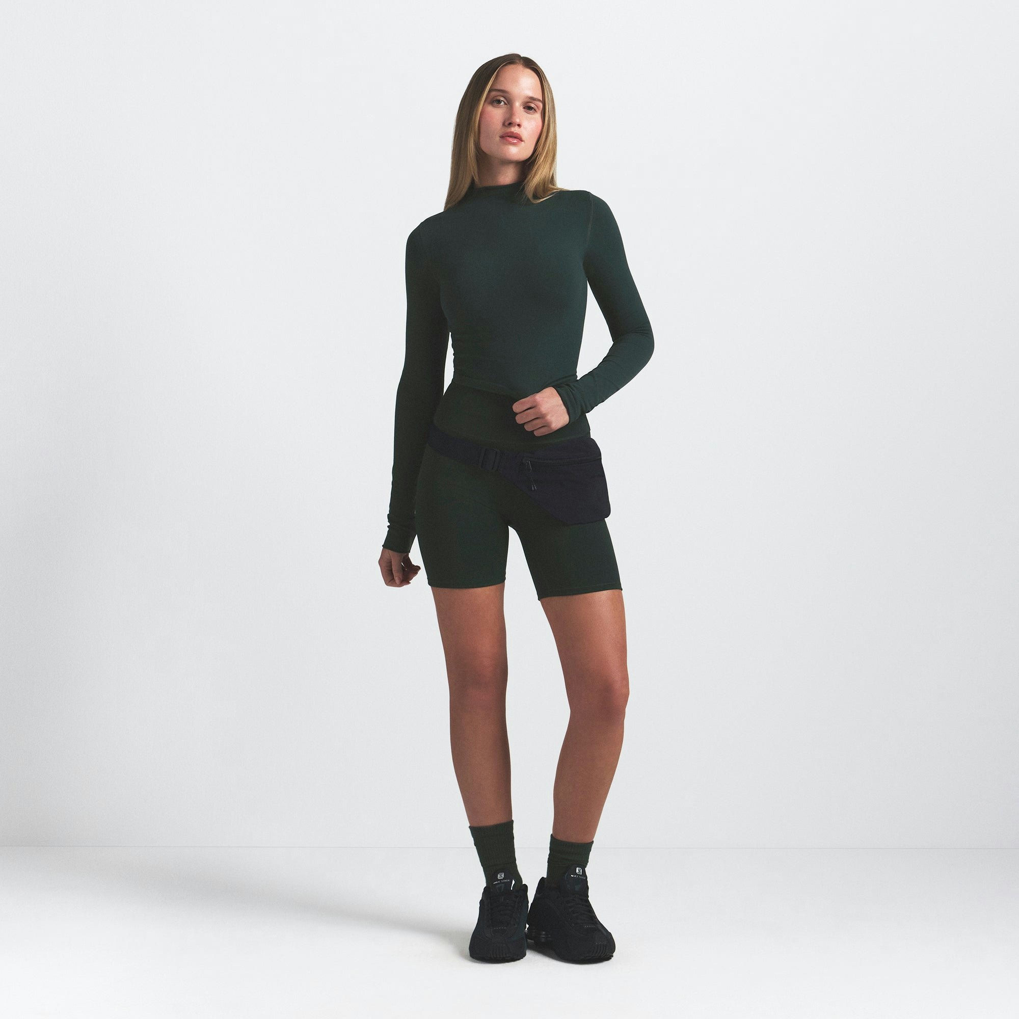 NikeSKIMS VINTAGE SEAMLESS MOCK NECK CROP TOP | DARK TEAL ON A MODEL FRONT VIEW @ | FOCUS: 0.0, 1.0, 0.9