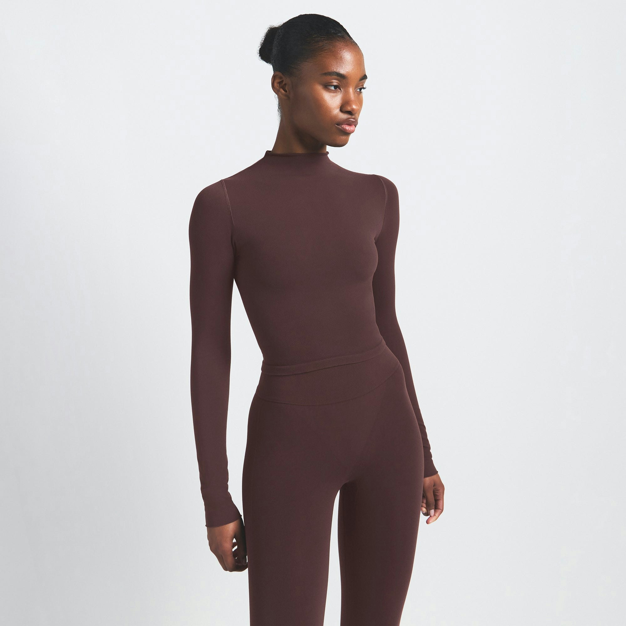 NikeSKIMS VINTAGE SEAMLESS MOCK NECK CROP TOP | PHOENIX ON A MODEL SIDE VIEW