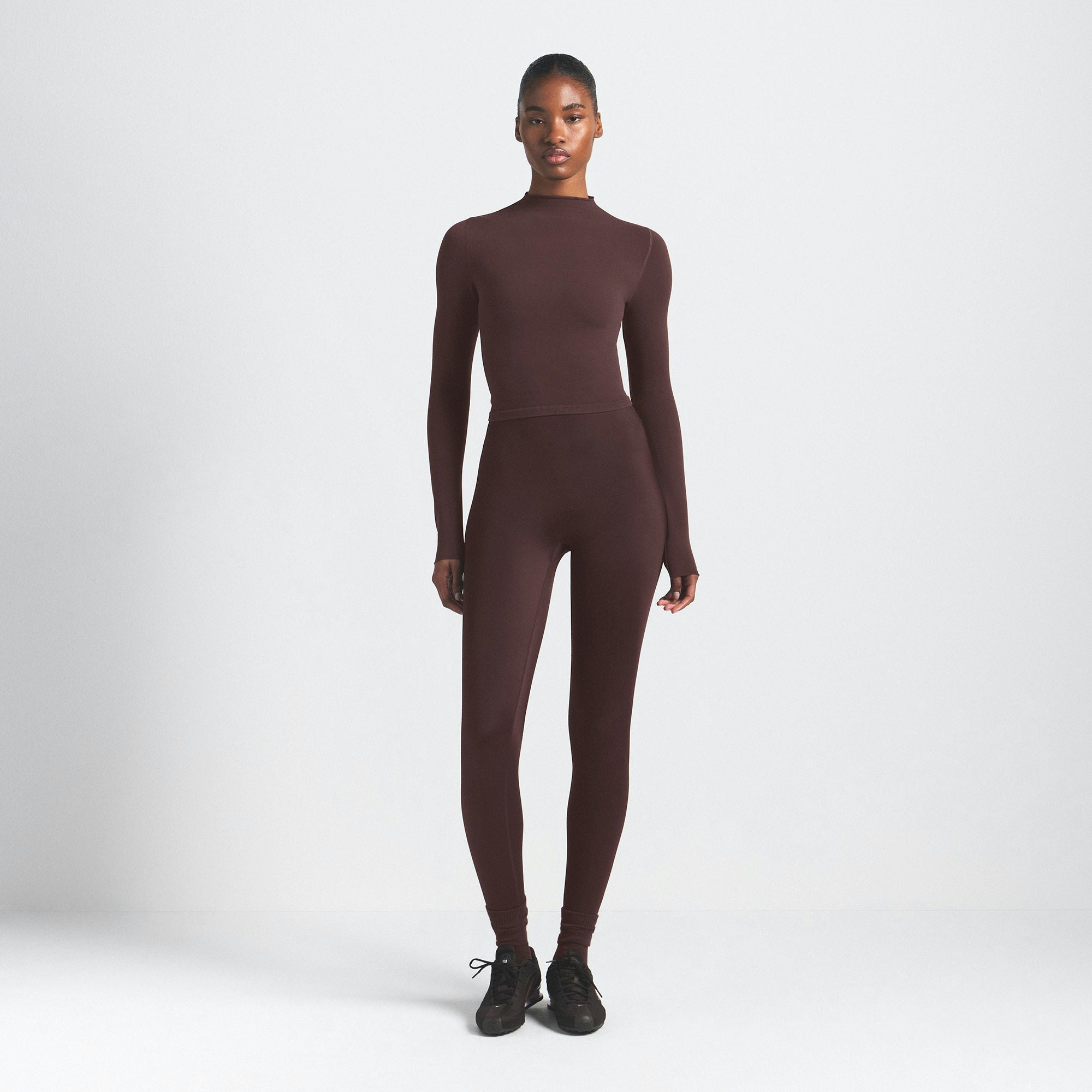 NikeSKIMS VINTAGE SEAMLESS MOCK NECK CROP TOP | PHOENIX ON A MODEL FRONT VIEW @ | FOCUS: 0.9, 0.1, 0.7