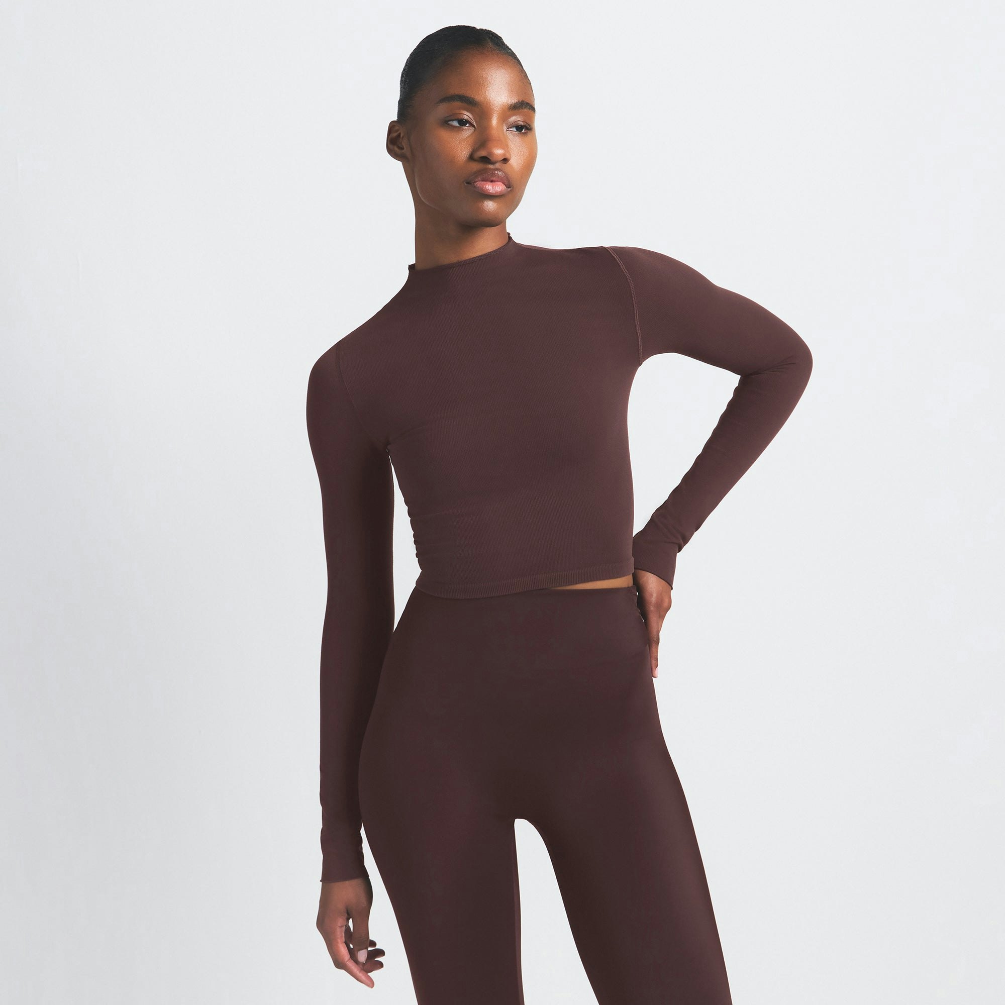 NikeSKIMS VINTAGE SEAMLESS MOCK NECK CROP TOP | PHOENIX ON A MODEL SIDE VIEW @ | FOCUS: 0.9, 0.1, 0.7