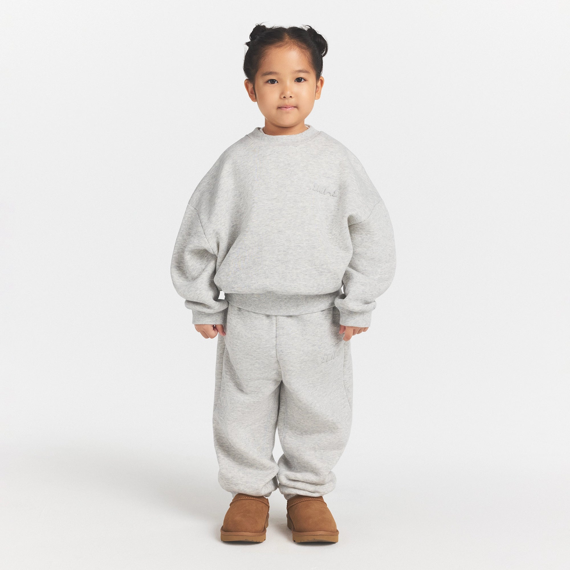 KIDS FLEECE CREWNECK PULLOVER | LIGHT HEATHER GREY ON A MODEL FRONT VIEW @ | FOCUS: 0.0, 1.0, 0.9