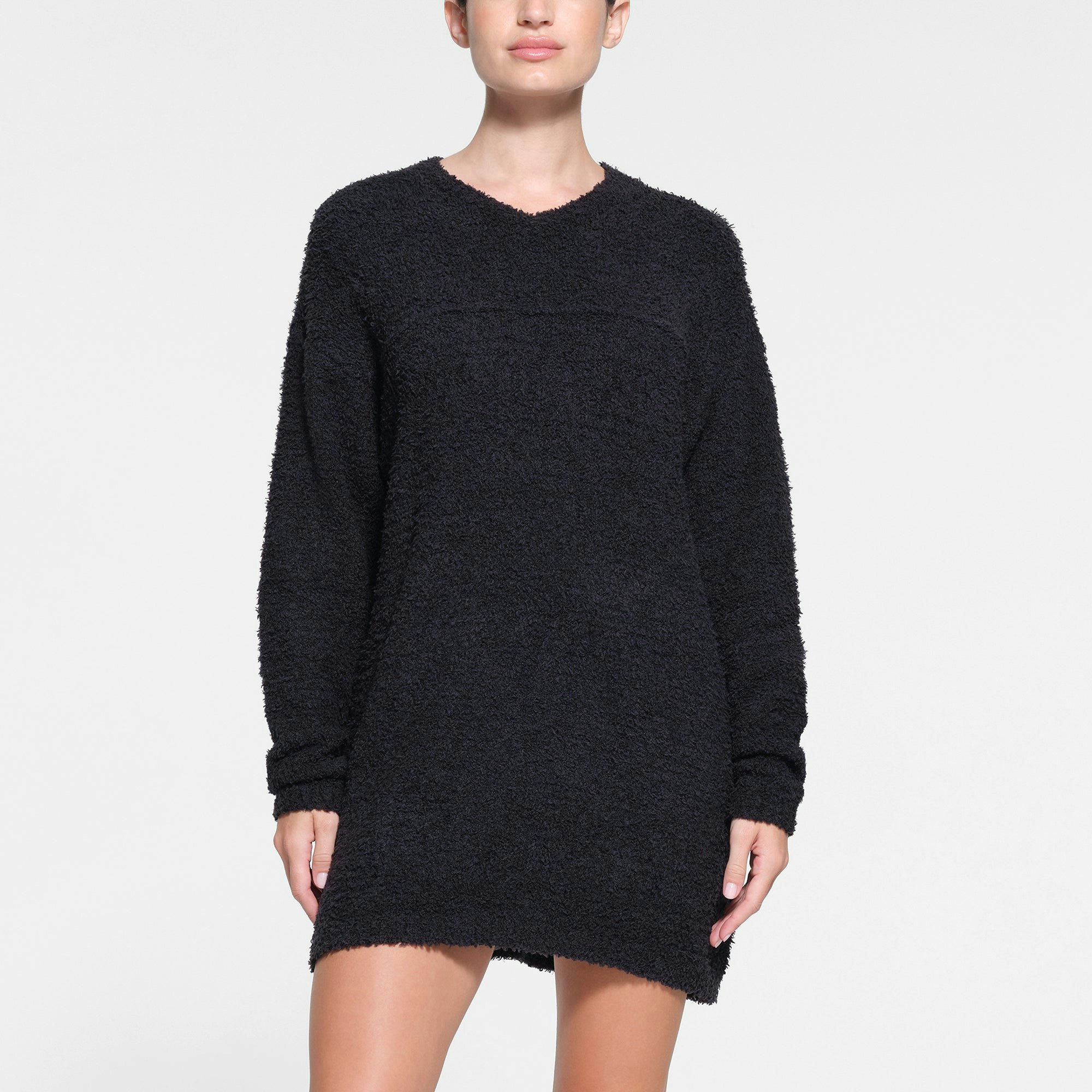 COZY KNIT V NECK MINI DRESS | ONYX ON A MODEL FRONT VIEW