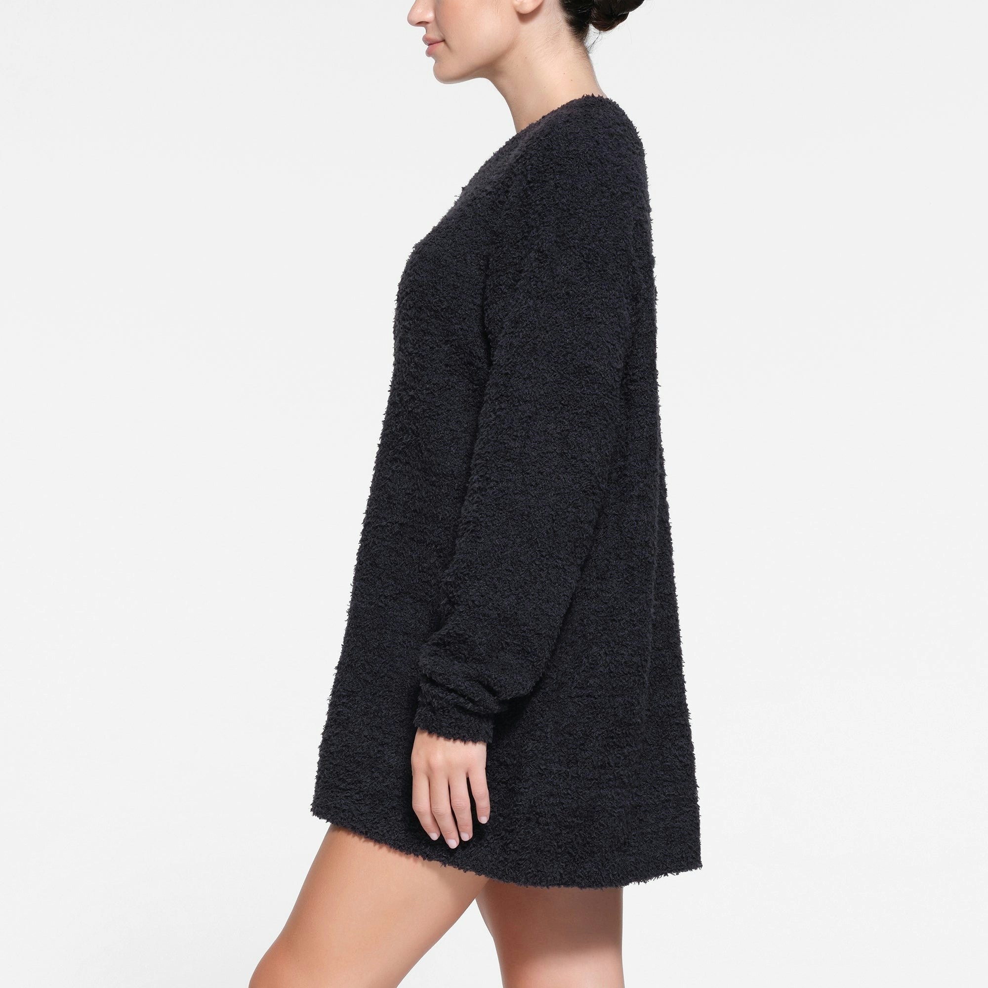 COZY KNIT V NECK MINI DRESS | ONYX ON A MODEL SIDE VIEW