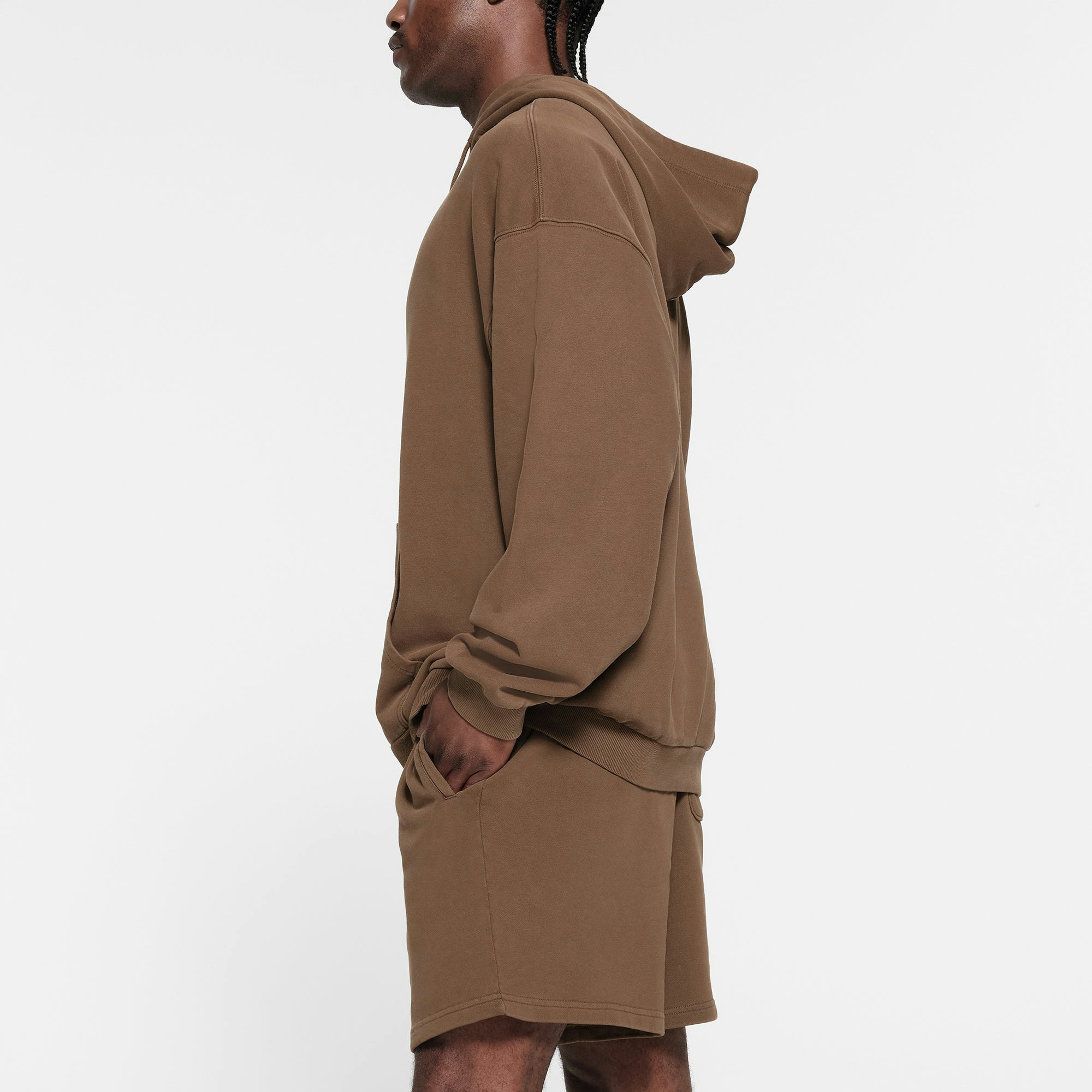 TERRY FLEECE MENS RELAXED HOODIE | OXIDE ON A MODEL SIDE VIEW