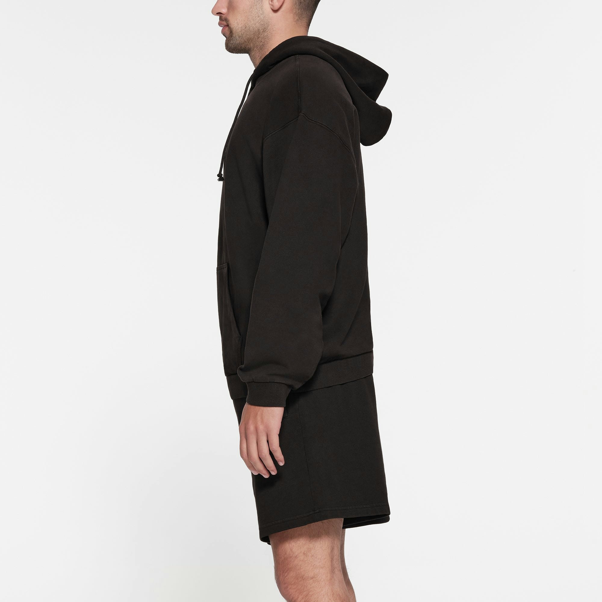 TERRY FLEECE MENS RELAXED HOODIE | WASHED OBSIDIAN ON A MODEL SIDE VIEW
