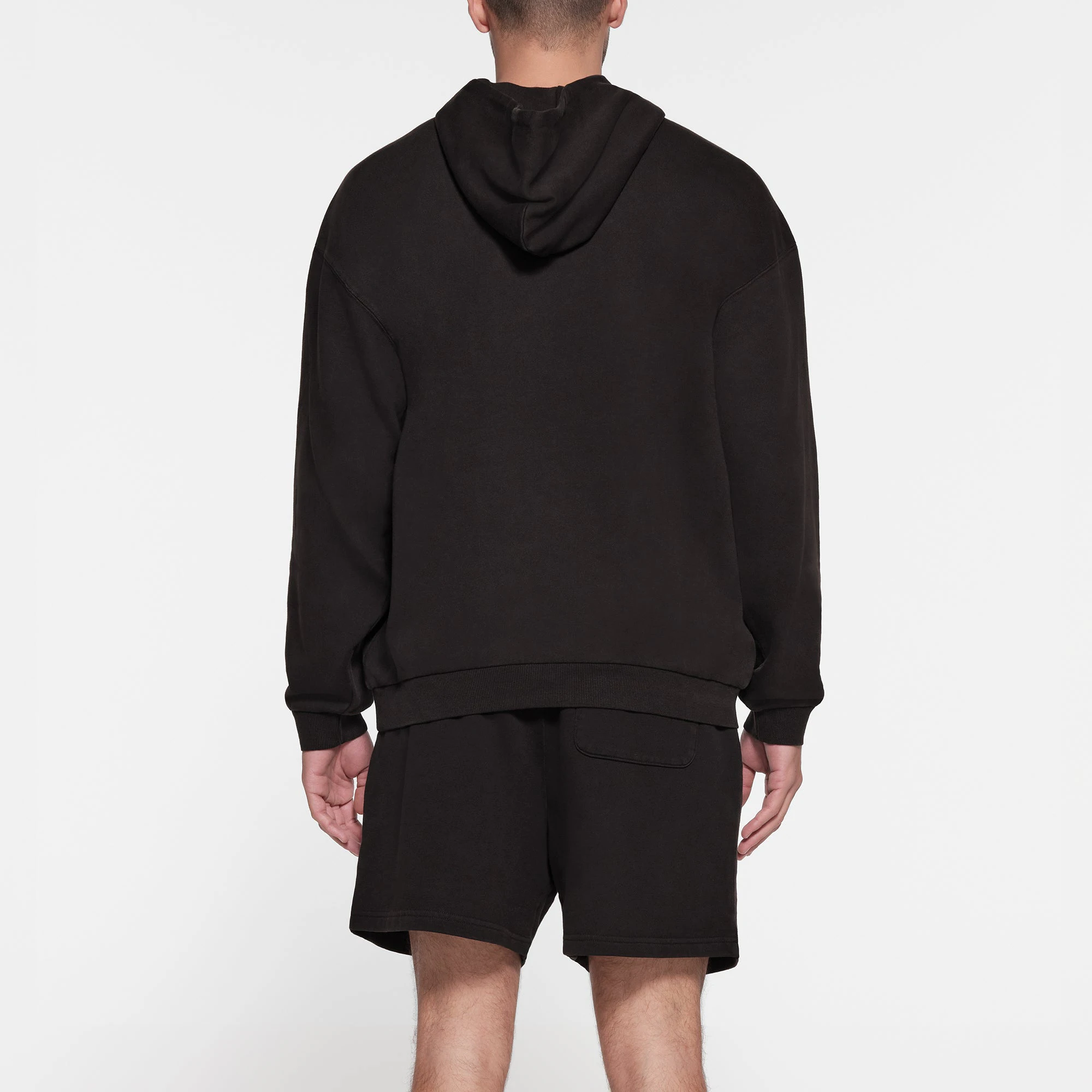 TERRY FLEECE MENS RELAXED HOODIE | WASHED OBSIDIAN ON A MODEL BACK VIEW
