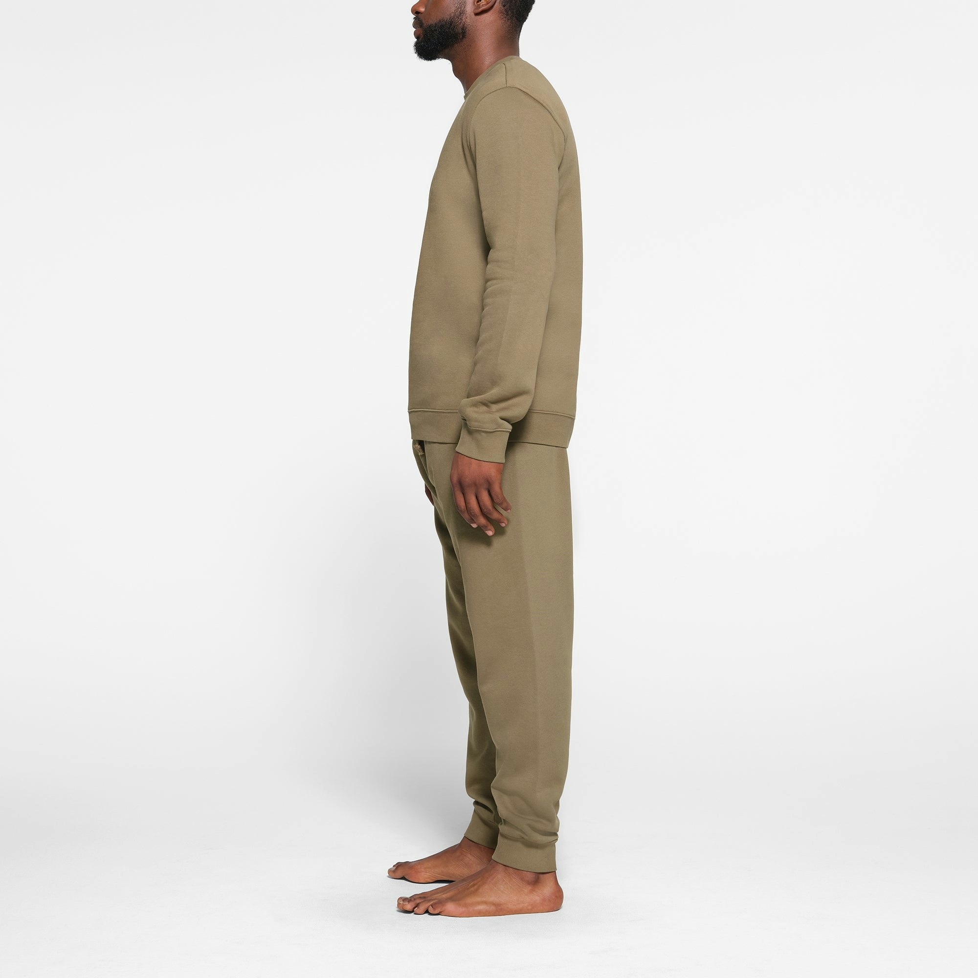 LOUNGE FLEECE MENS CREWNECK |  ON A MODEL SIDE VIEWARMY