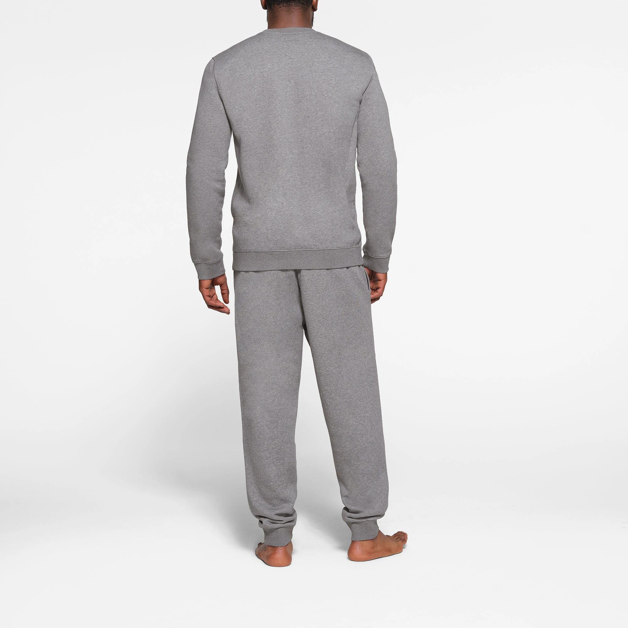 LOUNGE FLEECE MENS CREWNECK | DARK HEATHER GREY ON A MODEL BACK VIEW