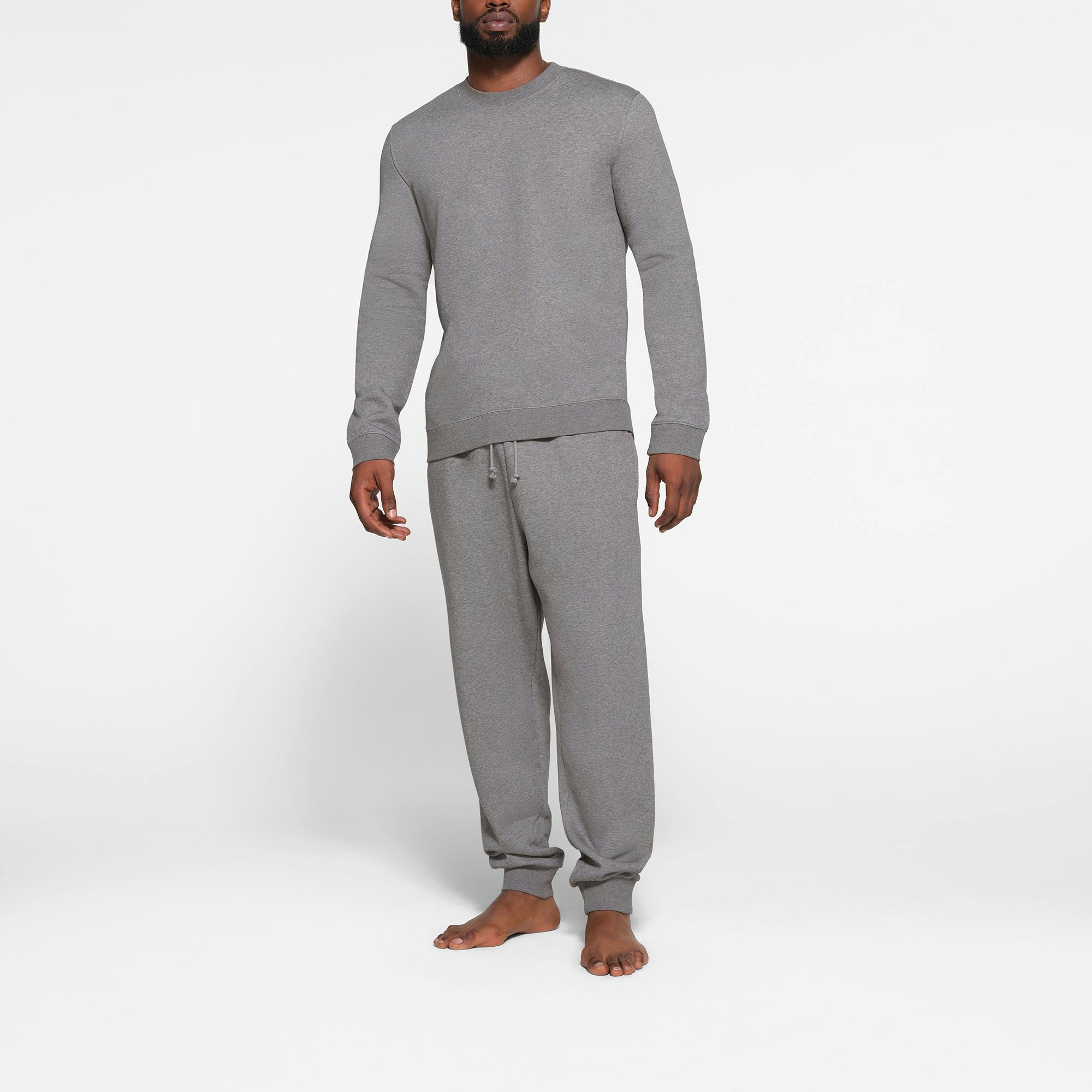 LOUNGE FLEECE MENS CREWNECK | DARK HEATHER GREY ON A MODEL FRONT VIEW