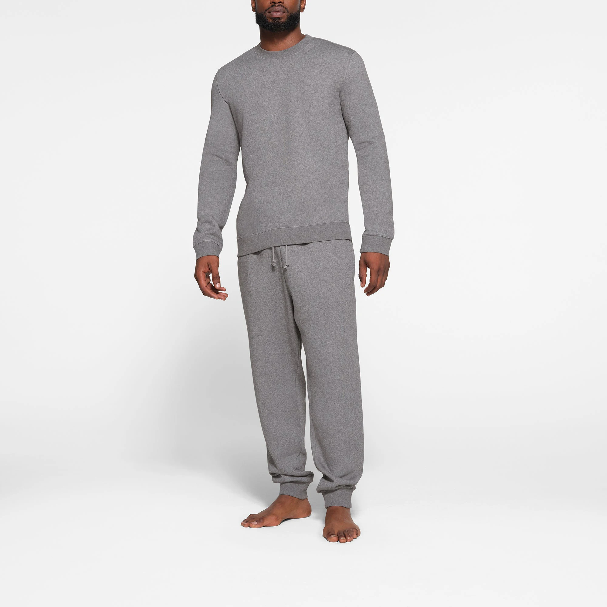 LOUNGE FLEECE MENS CREWNECK | DARK HEATHER GREY ON A MODEL FRONT VIEW