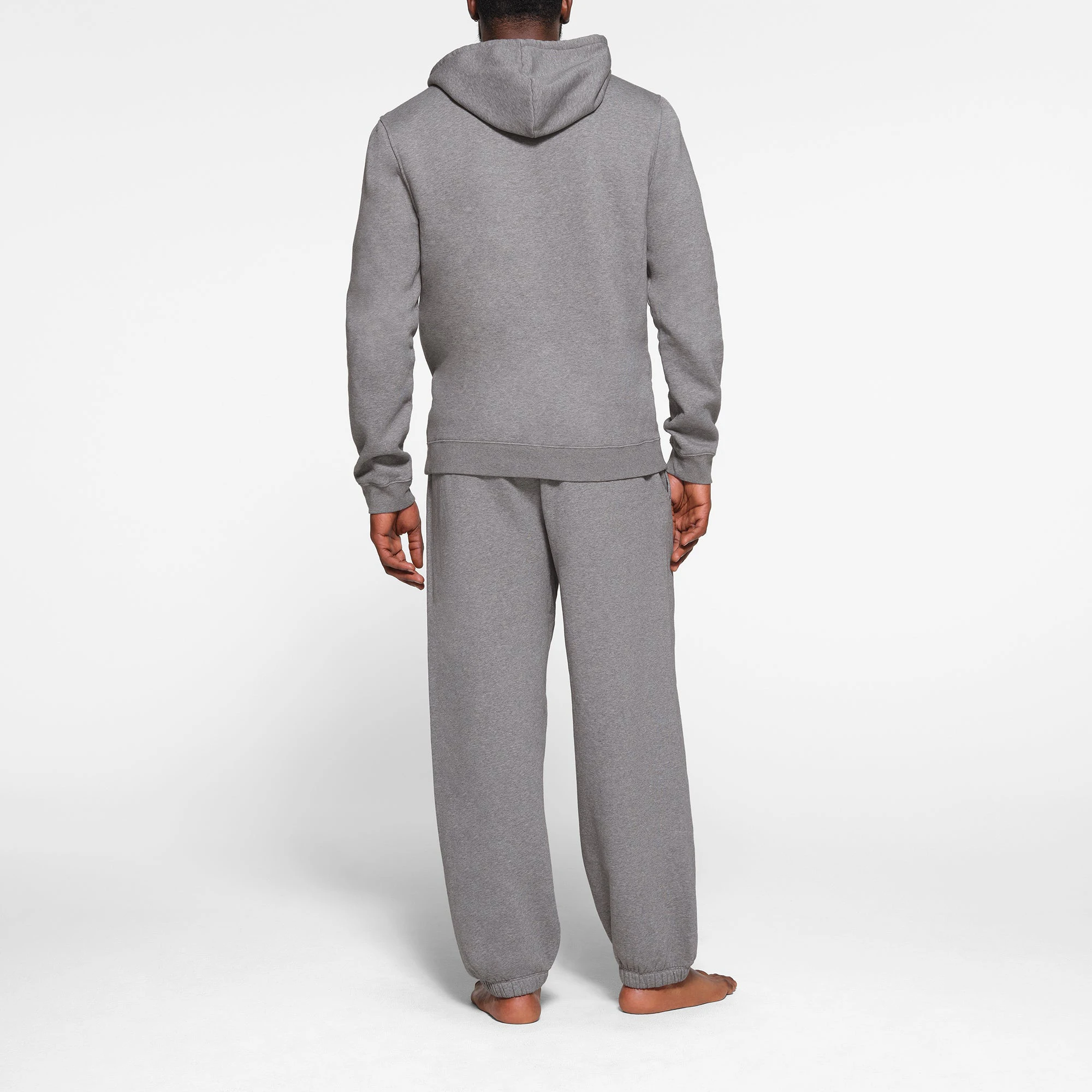 LOUNGE FLEECE MENS HOODIE | DARK HEATHER GREY ON A MODEL BACK VIEW