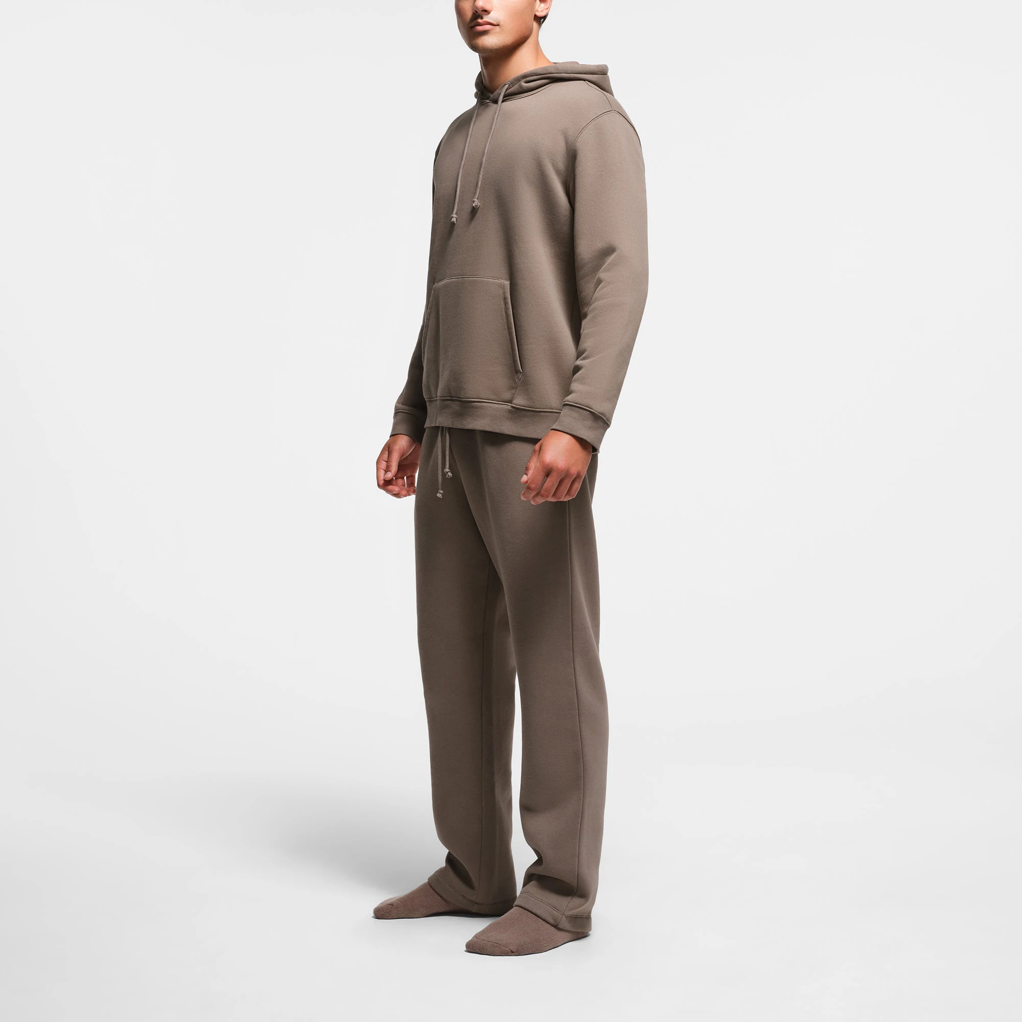 FLEECE LOUNGE MENS CLASSIC HOODIE | TRUFFLE ON A MODEL SIDE VIEW