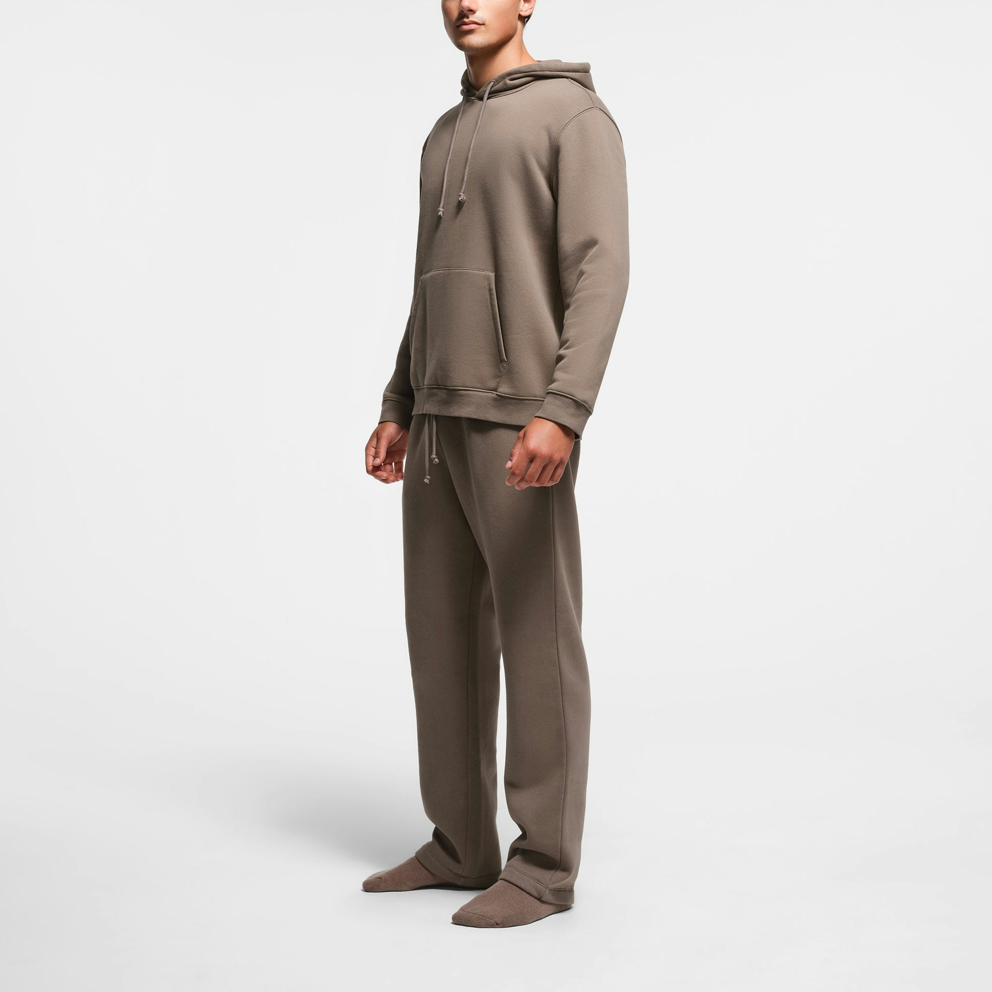 FLEECE LOUNGE MENS CLASSIC HOODIE | TRUFFLE ON A MODEL SIDE VIEW