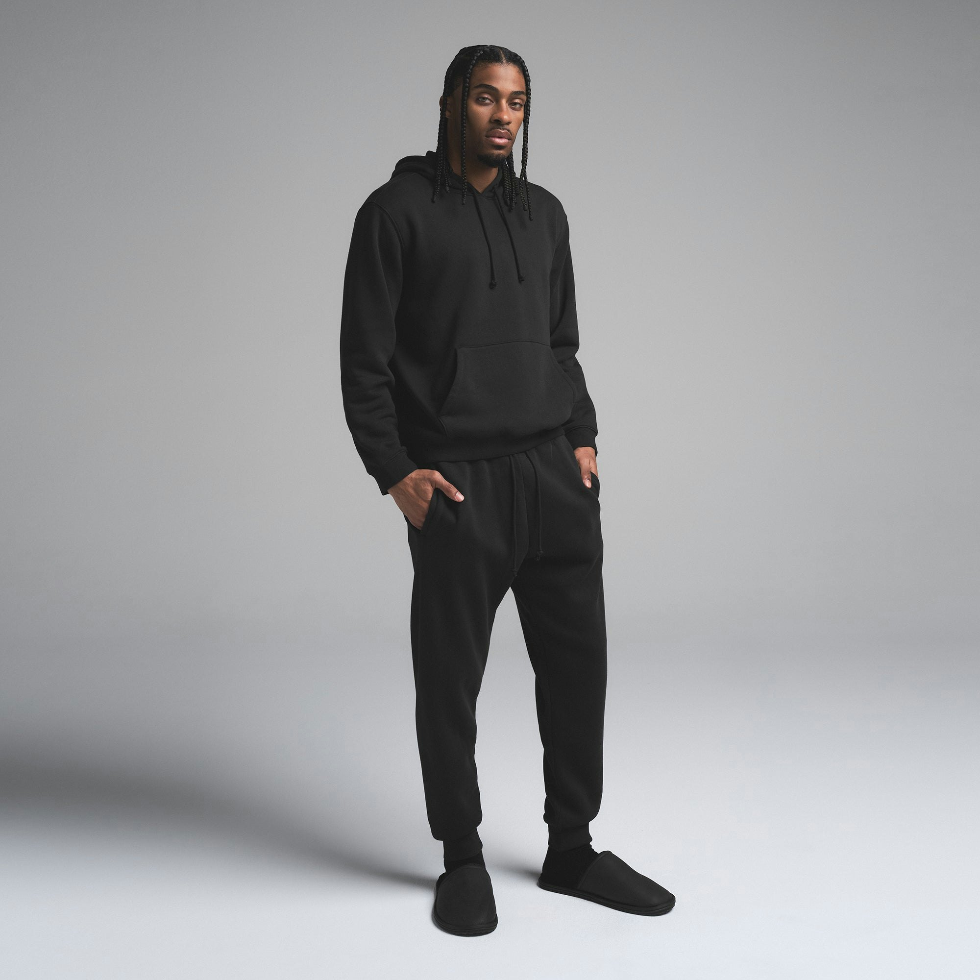 FLEECE LOUNGE MENS CLASSIC HOODIE | WASHED ONYX ON A MODEL SIDE VIEW | FOCUS: 0.0, 1.0, 0.9