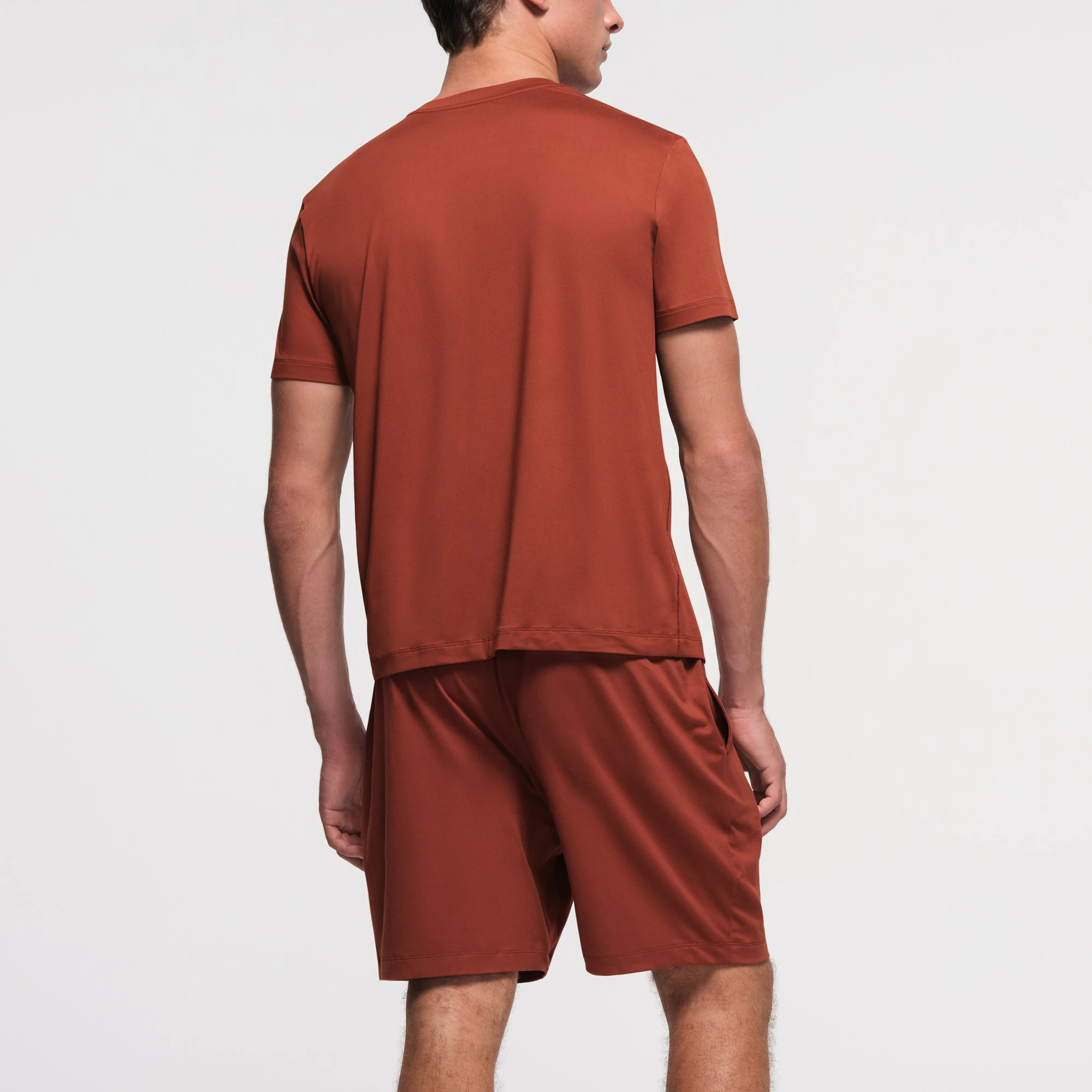 OUTDOOR JERSEY MENS CLASSIC T-SHIRT | RUST ON A MODEL BACK VIEW