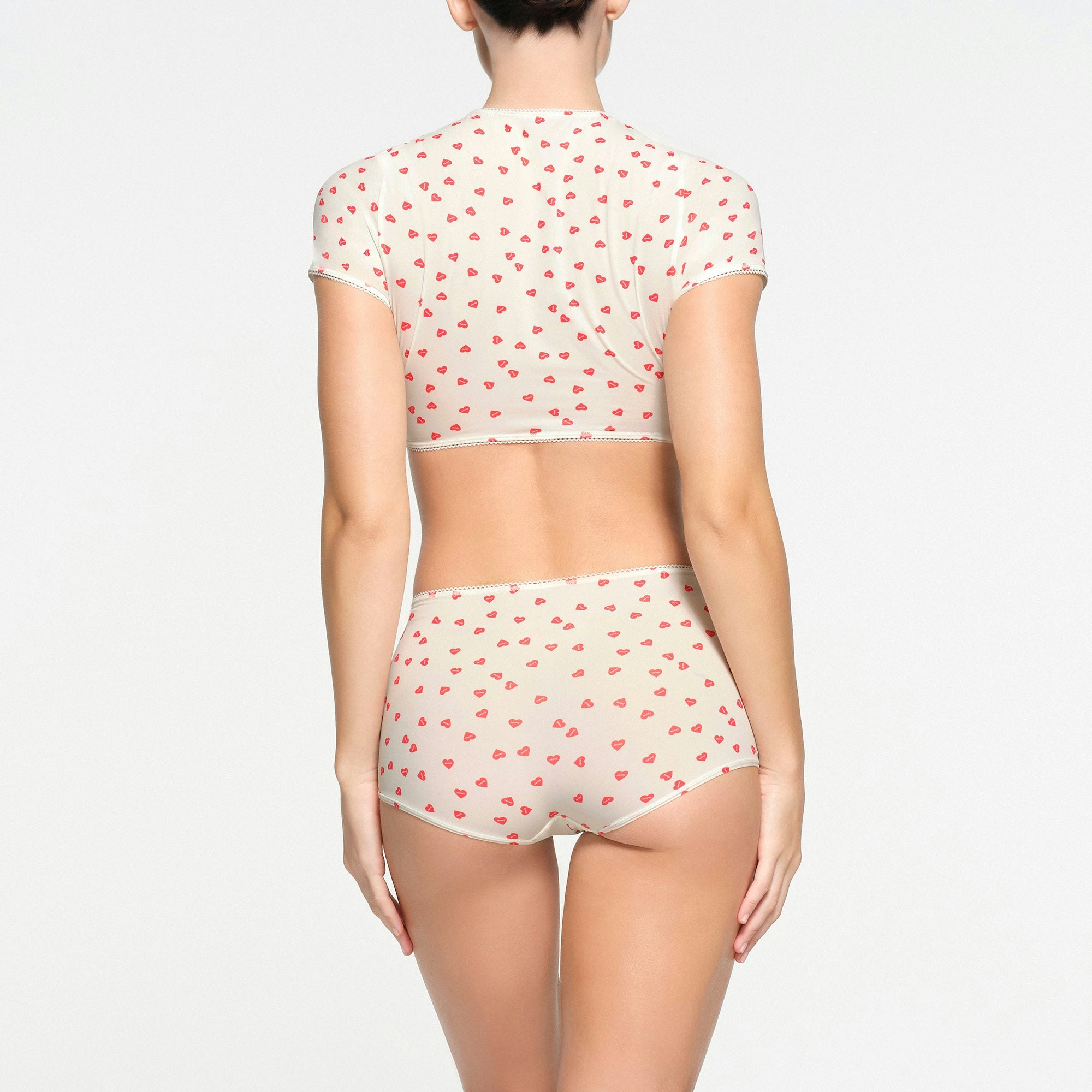 FITS EVERYBODY PICOT TRIM SUPER CROPPED T-SHIRT | RUBY HEART PRINT ON A MODEL BACK VIEW