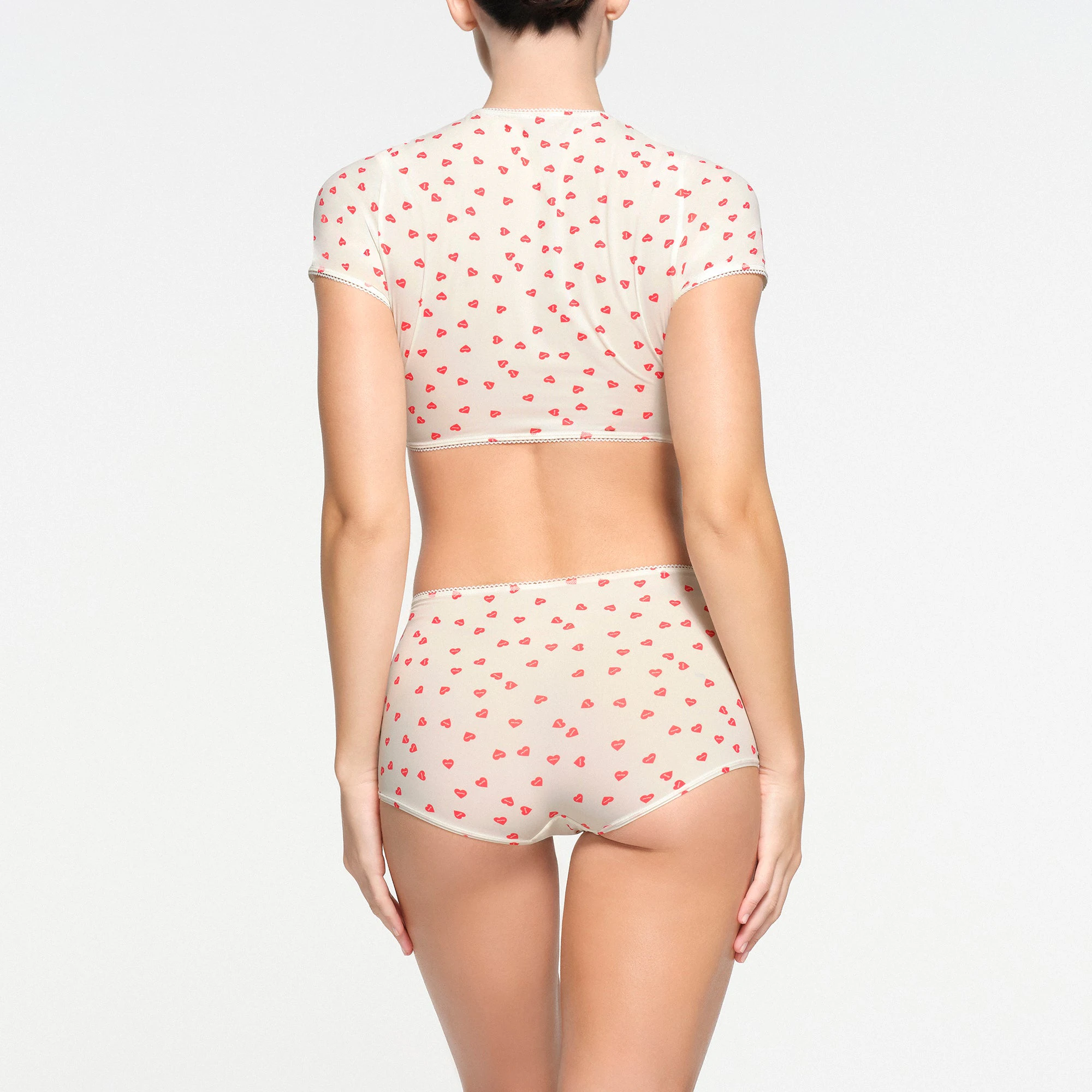 FITS EVERYBODY PICOT TRIM SUPER CROPPED T-SHIRT | RUBY HEART PRINT ON A MODEL BACK VIEW