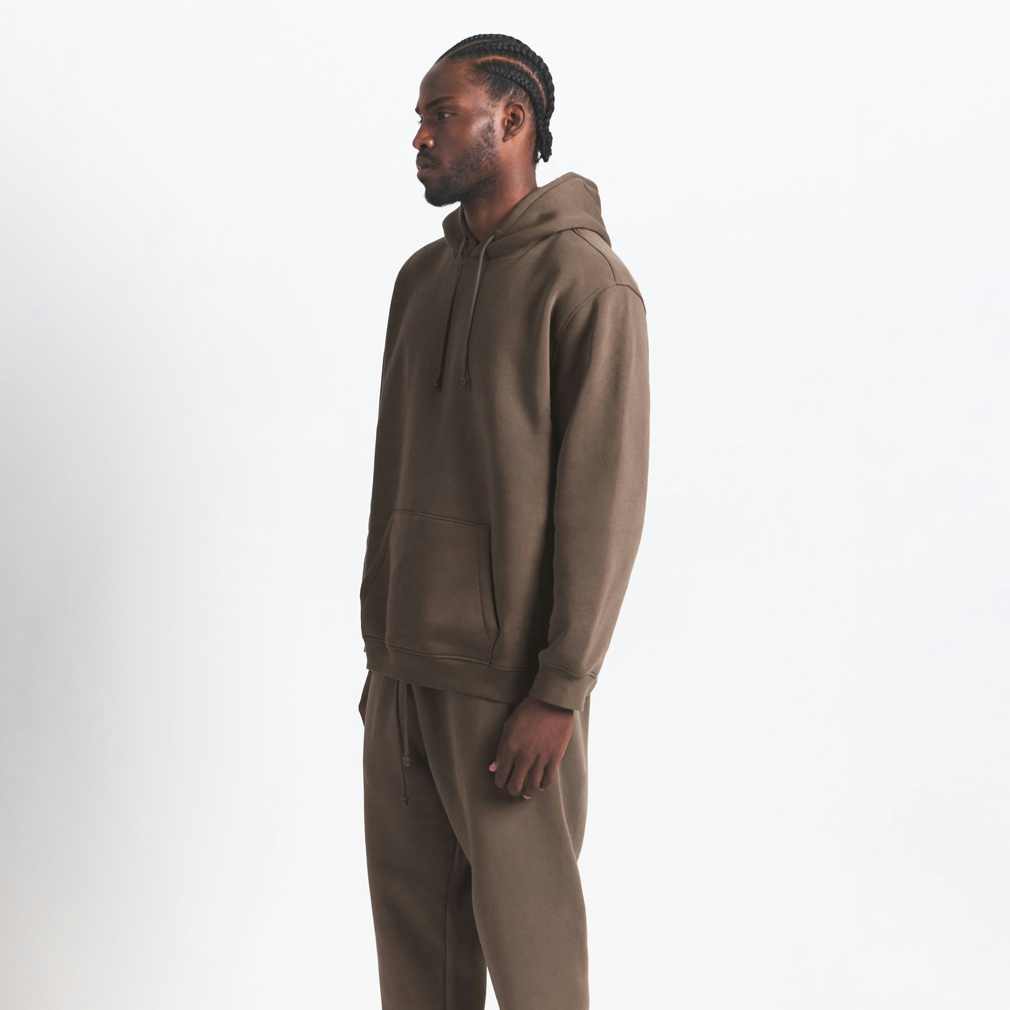 FLEECE LOUNGE MENS CLASSIC HOODIE | DRIFTWOOD ON A MODEL SIDE VIEW @ | FOCUS: 0.0, 1.0, 0.9