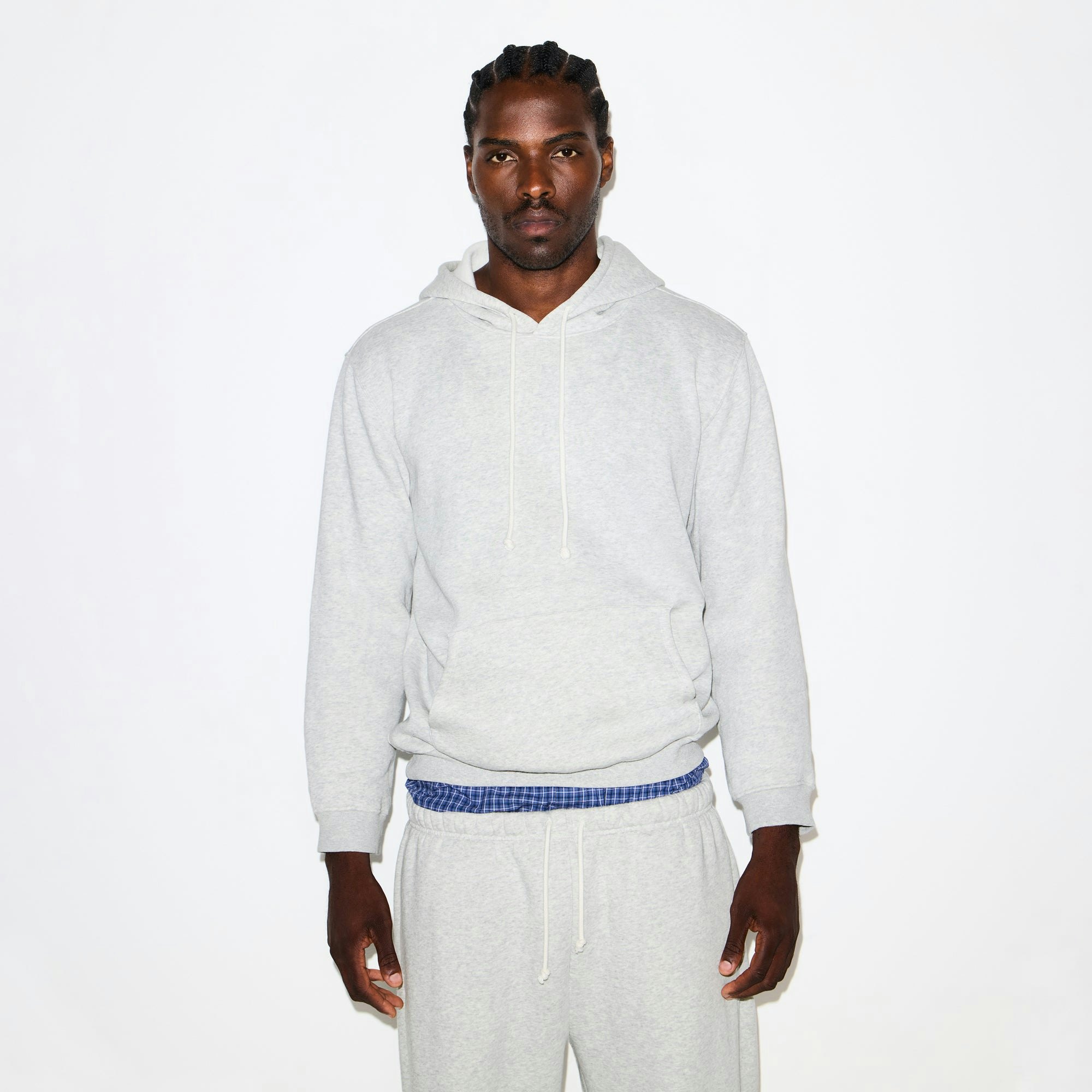 FLEECE LOUNGE MENS CLASSIC HOODIE | LIGHT HEATHER GREY ON A MODEL SIDE VIEW @ | FOCUS: 0.0, 1.0, 0.9