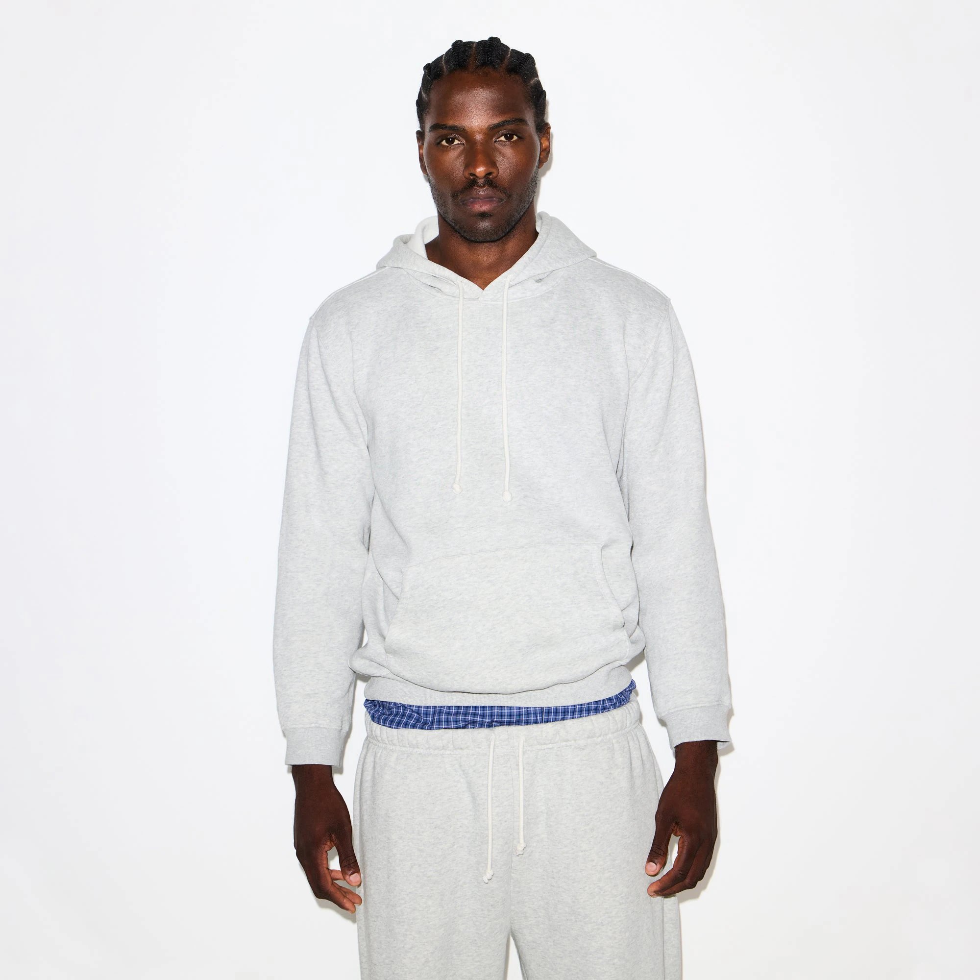 FLEECE LOUNGE MENS CLASSIC HOODIE | LIGHT HEATHER GREY ON A MODEL SIDE VIEW @ | FOCUS: 0.0, 1.0, 0.9