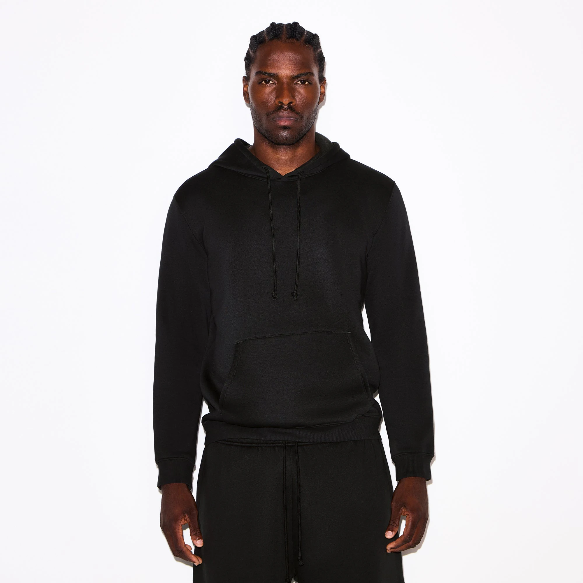 FLEECE LOUNGE MENS CLASSIC HOODIE | WASHED ONYX ON A MODEL SIDE VIEW @ | FOCUS: 0.0, 1.0, 0.9