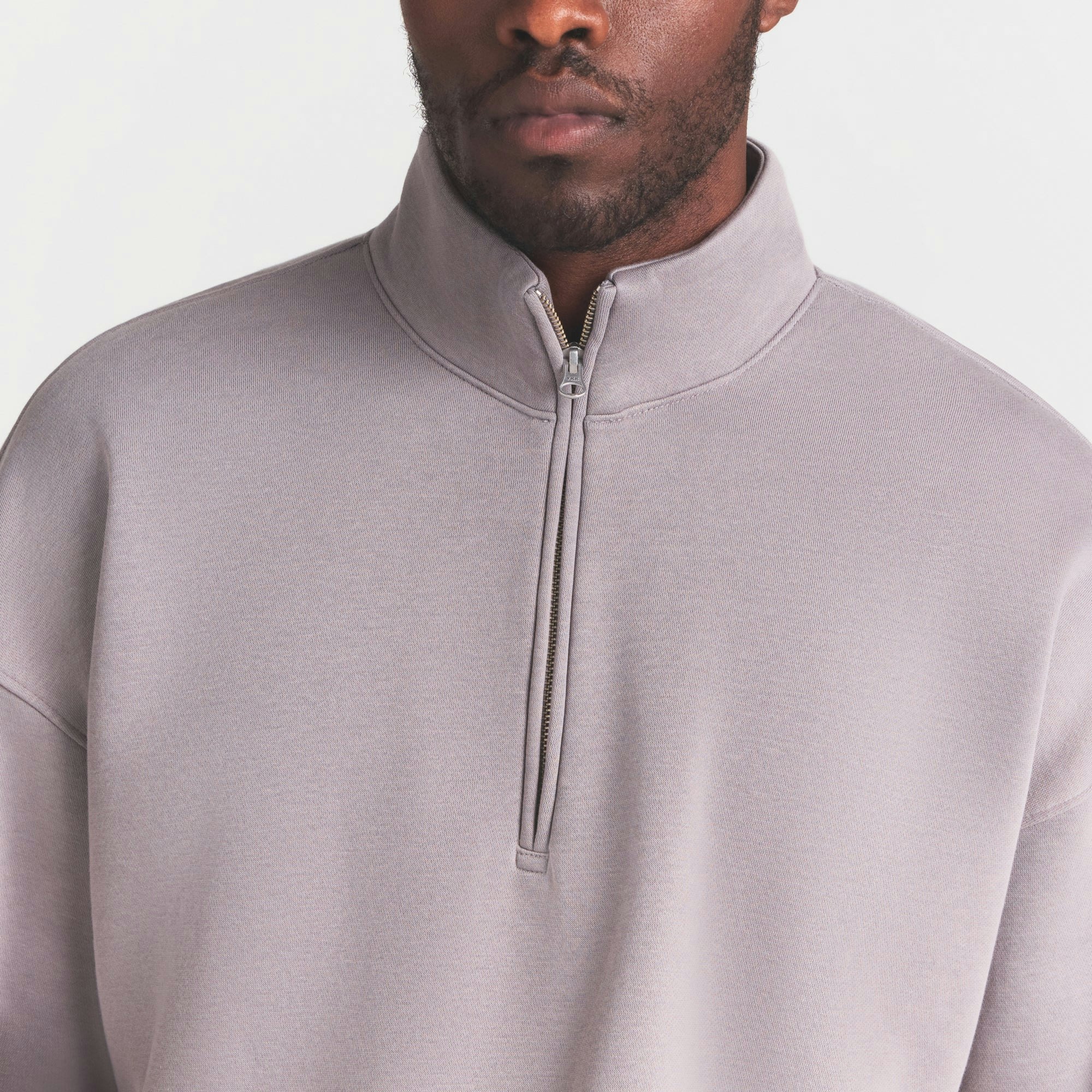 FLEECE LOUNGE MENS RELAXED QUARTER ZIP | SHADOW ON A MODEL SIDE VIEW @ | FOCUS: 0.0, 1.0, 0.9