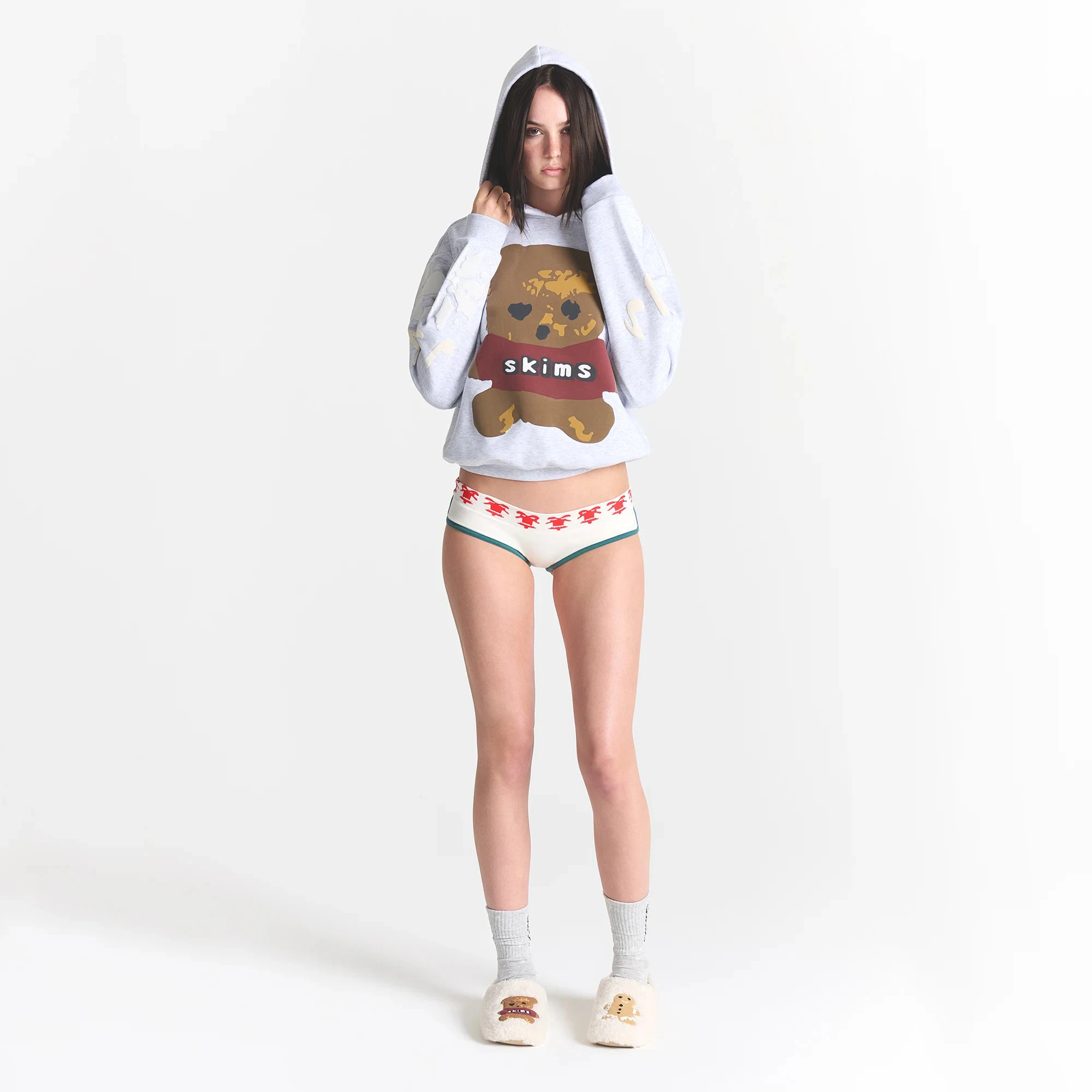 CACTUS PLANT FLEA MARKET X SKIMS COTTON FLEECE HOODIE | LIGHT HEATHER GREY TEDDY BEAR PRINT ON A MODEL FRONT VIEW @ | FOCUS: 0.0, 1.0, 0.9