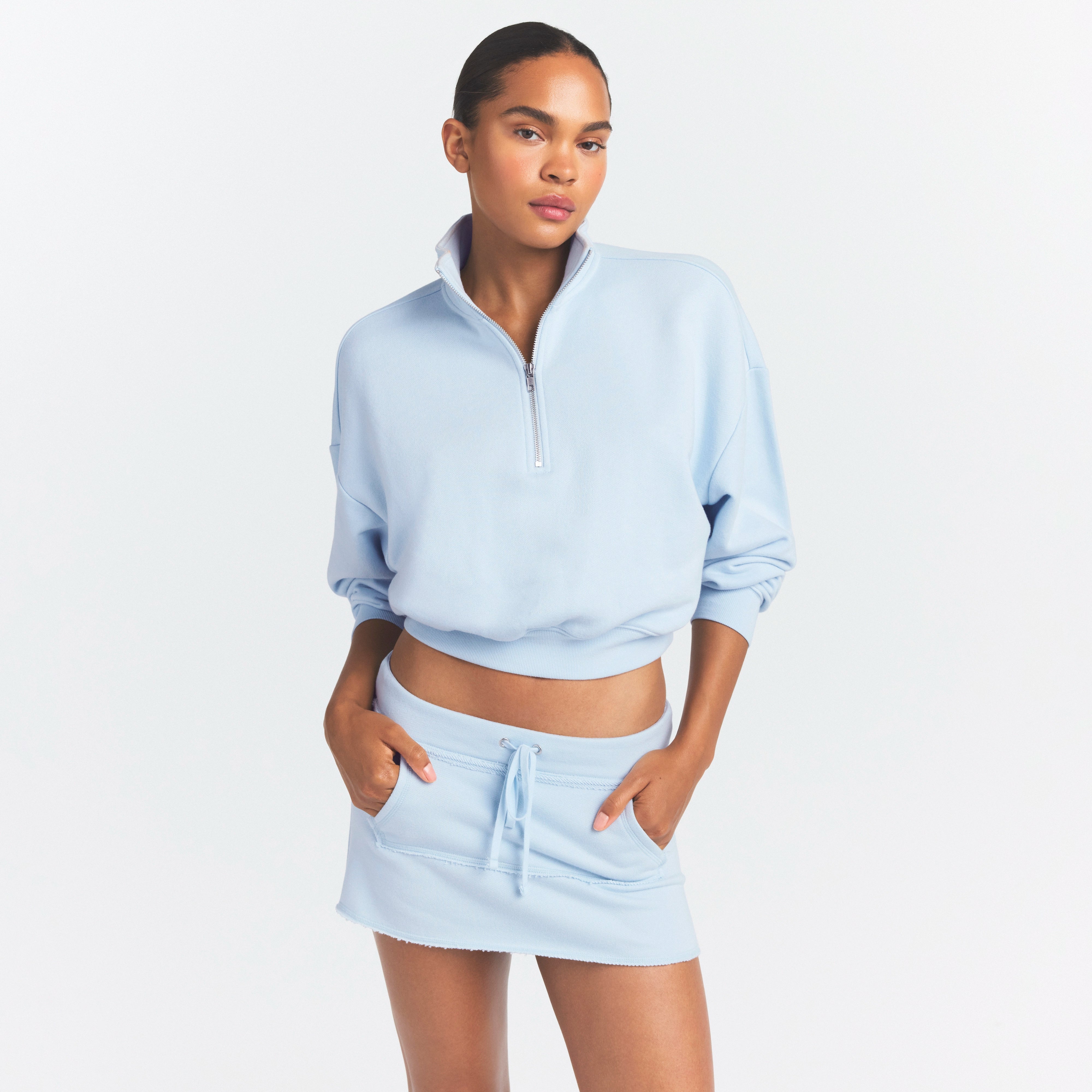 DRAPEY FRENCH TERRY HALF ZIP | POWDER BLUE ON A MODEL SIDE VIEW @ | FOCUS: 0.0, 1.0, 0.9