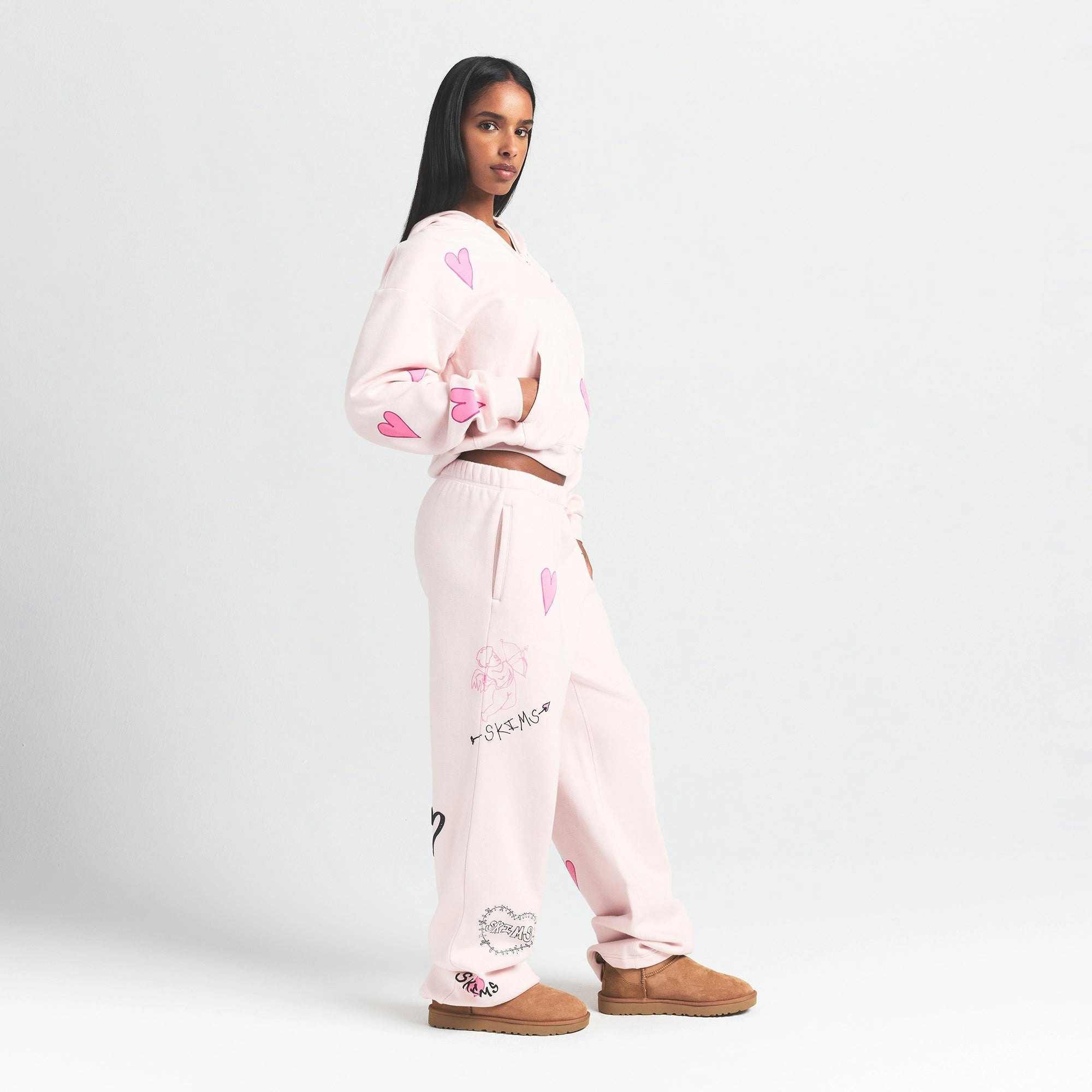COTTON FLEECE CLASSIC ZIP UP HOODIE | BARELY PINK HEART ON A MODEL SIDE VIEW @ | FOCUS: 0.0, 1.0, 0.9