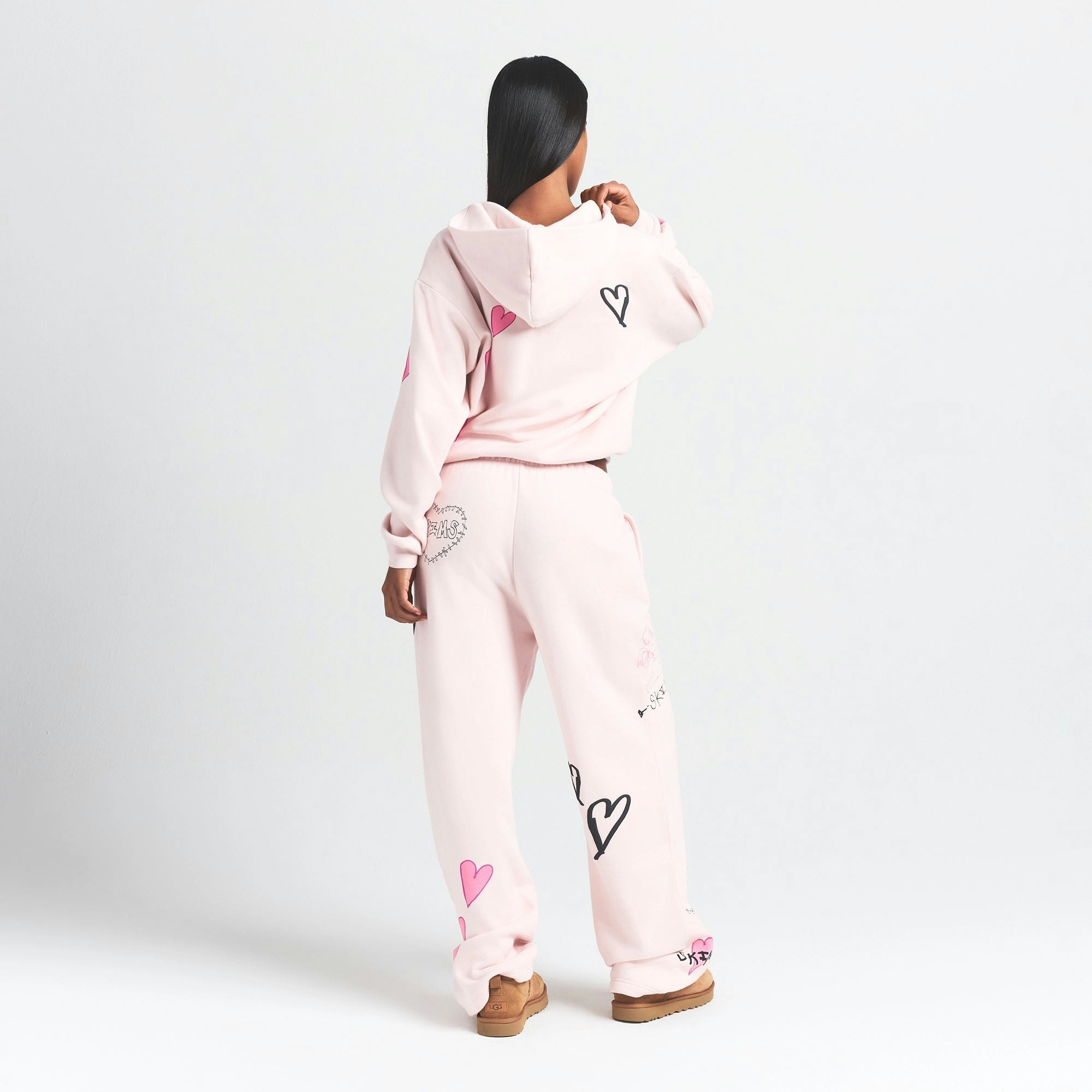 COTTON FLEECE CLASSIC ZIP UP HOODIE | BARELY PINK HEART ON A MODEL BACK VIEW @ | FOCUS: 0.0, 1.0, 0.9