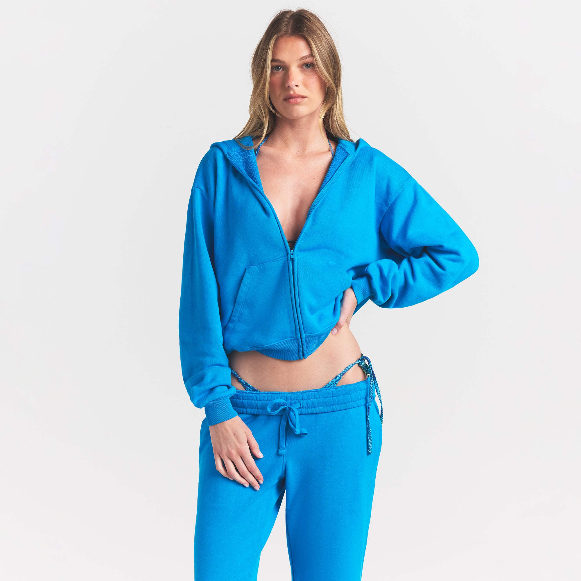 FRENCH TERRY ZIP UP HOODIE | CERULEAN ON A MODEL SIDE VIEW