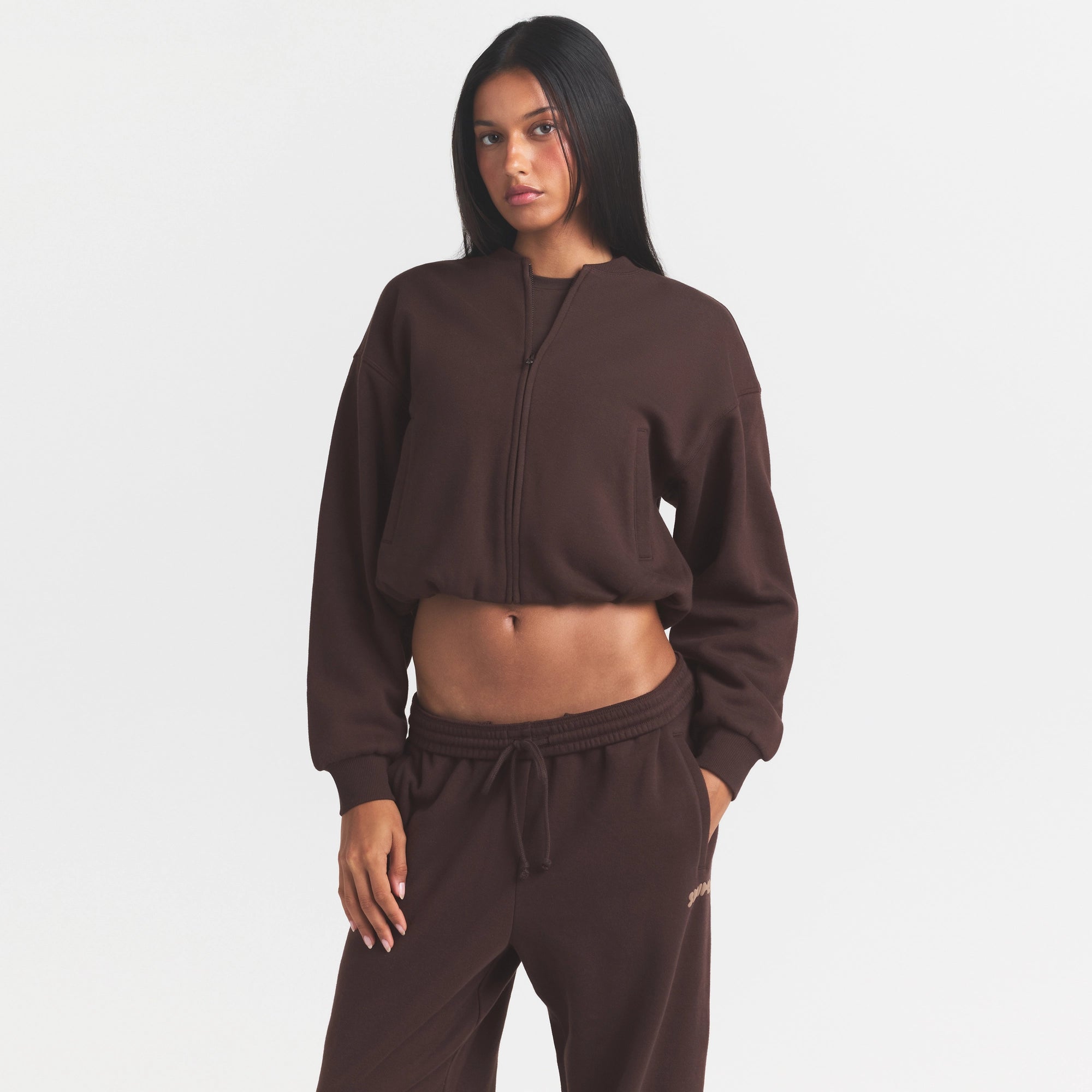 COTTON FLEECE BOMBER | ESPRESSO ON A MODEL SIDE VIEW @ | FOCUS: 0.0, 1.0, 0.9