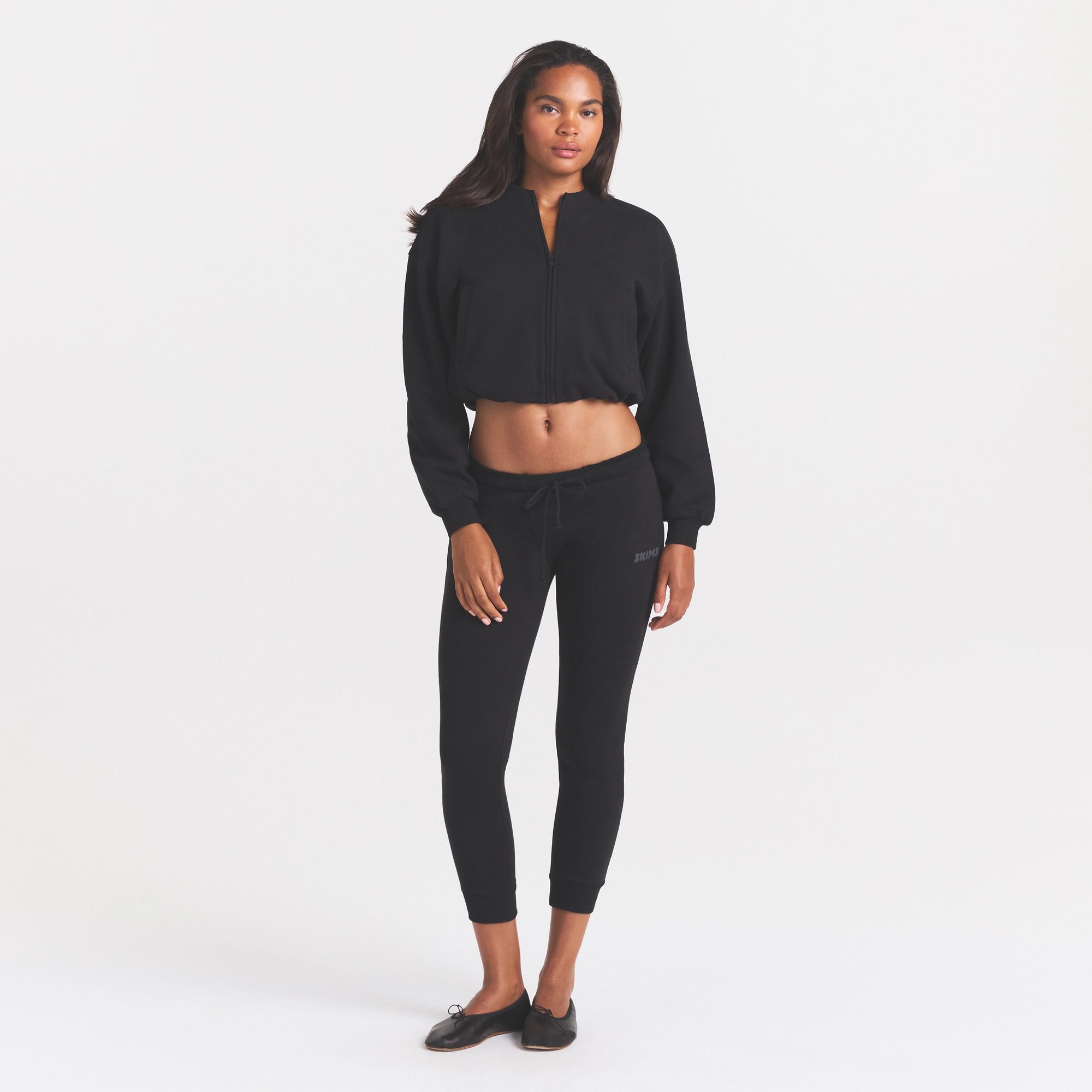 COTTON FLEECE BOMBER | ONYX ON A MODEL FRONT VIEW @ | FOCUS: 0.0, 1.0, 0.9