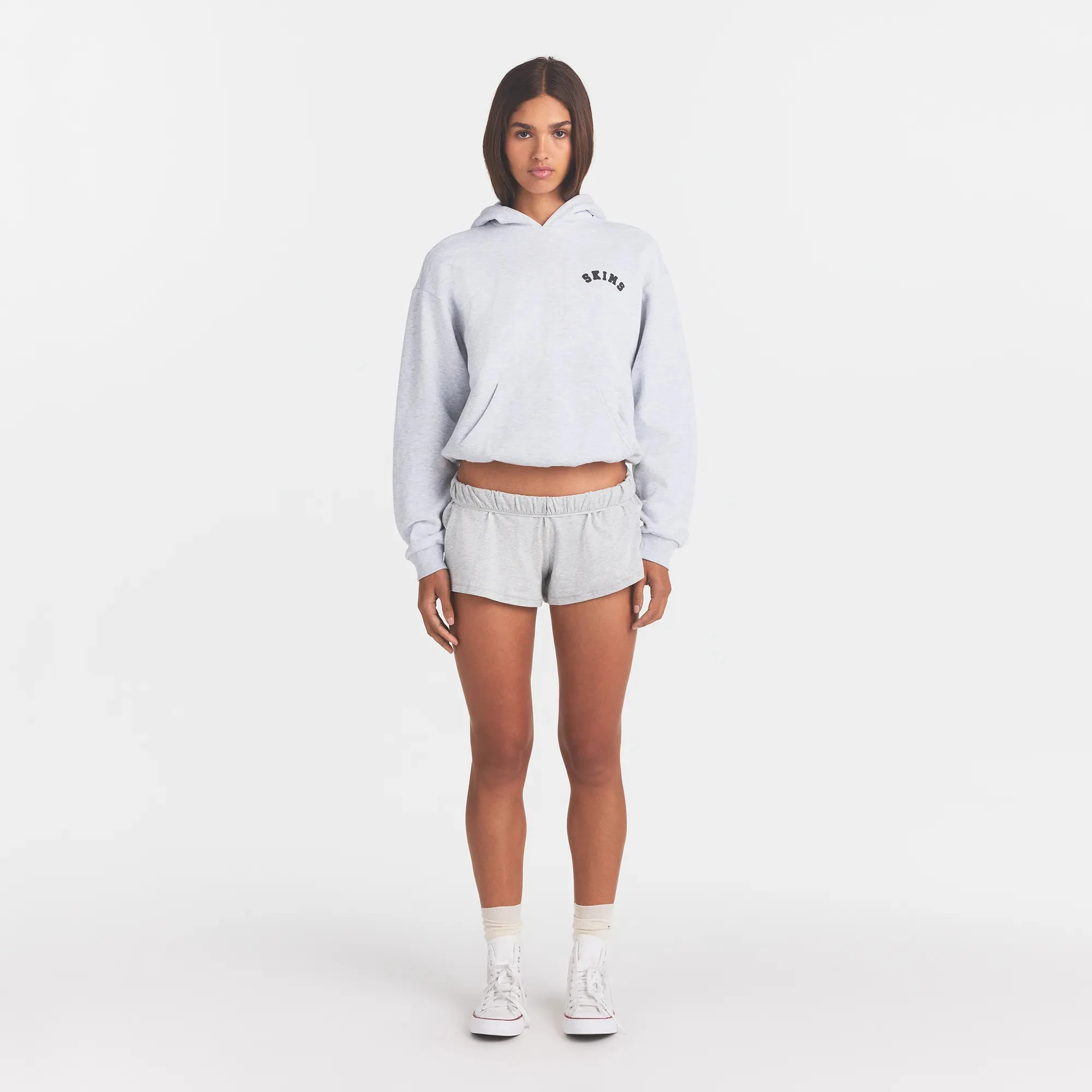 COTTON FLEECE CLASSIC HOODIE | LIGHT HEATHER GREY WITH ONYX LOGO ON A MODEL FRONT VIEW @ | FOCUS: 0.0, 1.0, 0.9