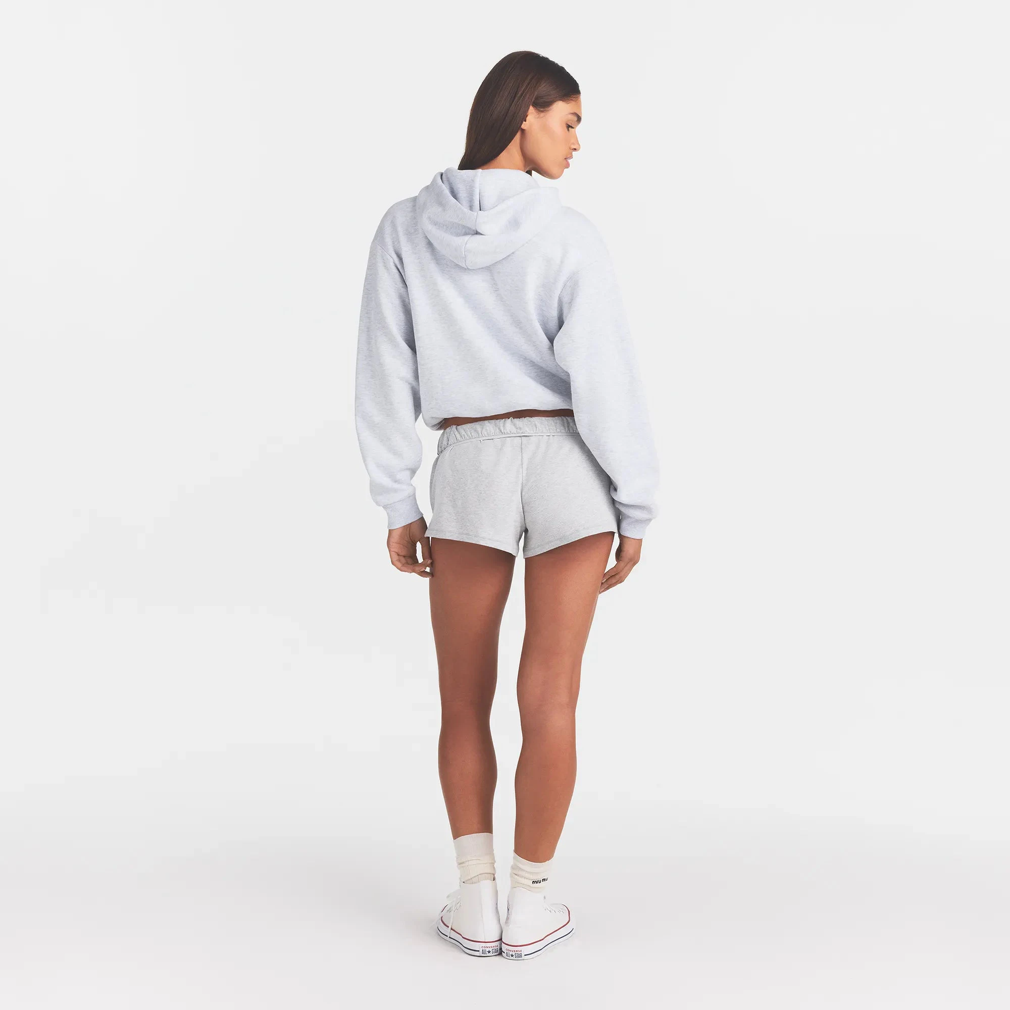 COTTON FLEECE CLASSIC HOODIE | LIGHT HEATHER GREY WITH ONYX LOGO ON A MODEL BACK VIEW @ | FOCUS: 0.0, 1.0, 0.9