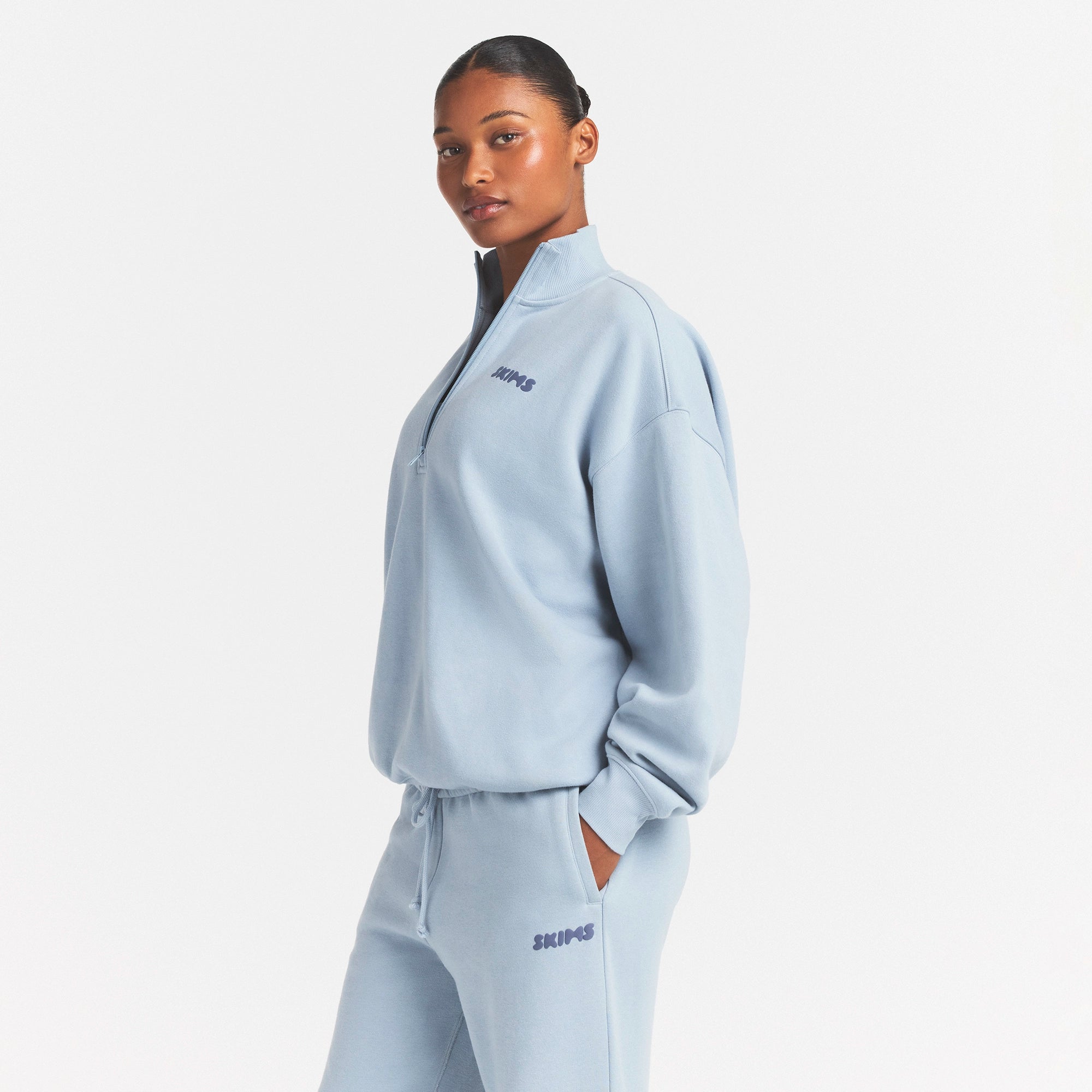 COTTON FLEECE MOCK NECK QUARTER ZIP WITH EMBOSSED LOGO | FOG ON A MODEL FRONT VIEW @ | FOCUS: 0.0, 1.0, 0.9
