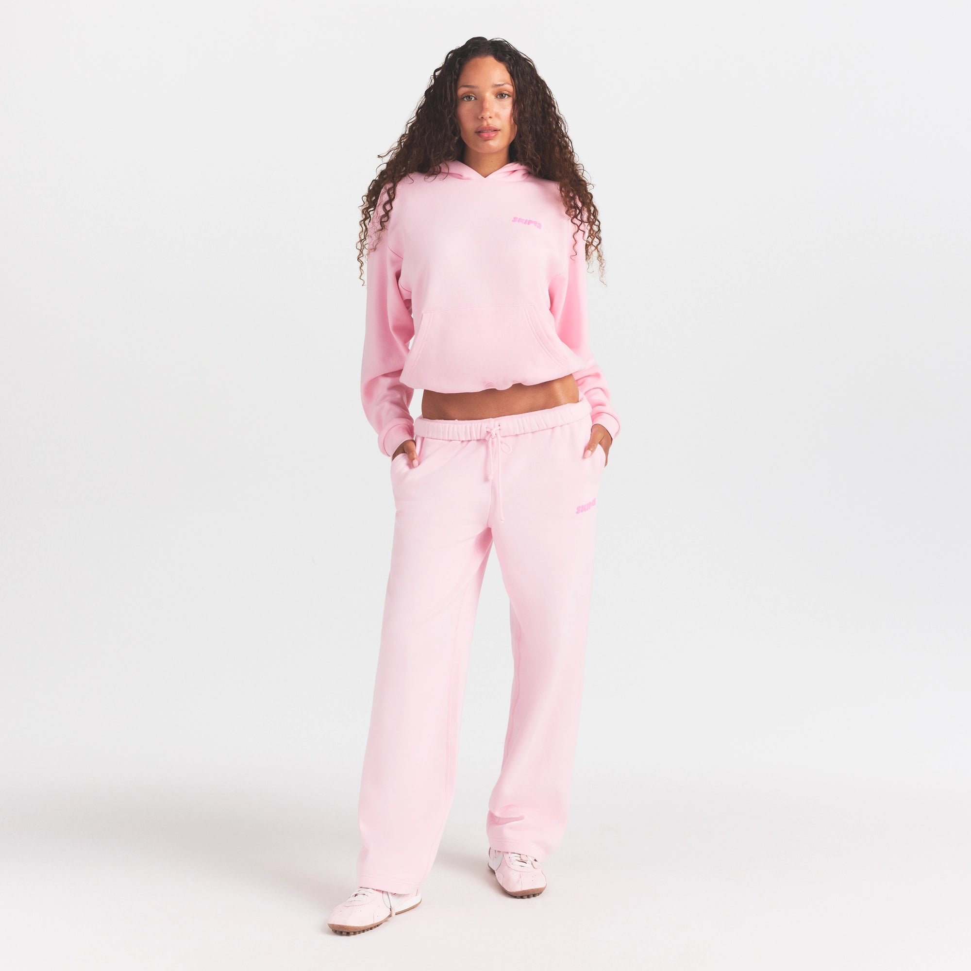 COTTON FLEECE HOODIE WITH EMBOSSED LOGO | CHERRY BLOSSOM ON A MODEL FRONT VIEW @ | FOCUS: 0.0, 1.0, 0.9
