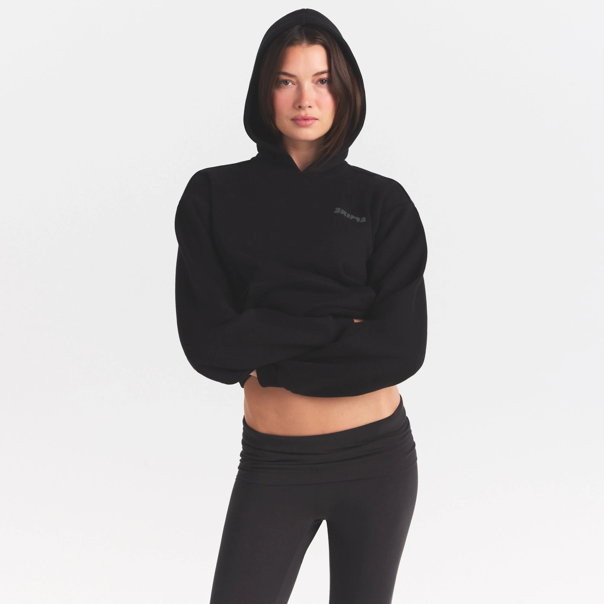 COTTON FLEECE HOODIE WITH EMBOSSED LOGO | ONYX ON A MODEL SIDE VIEW @ | FOCUS: 0.0, 1.0, 0.9