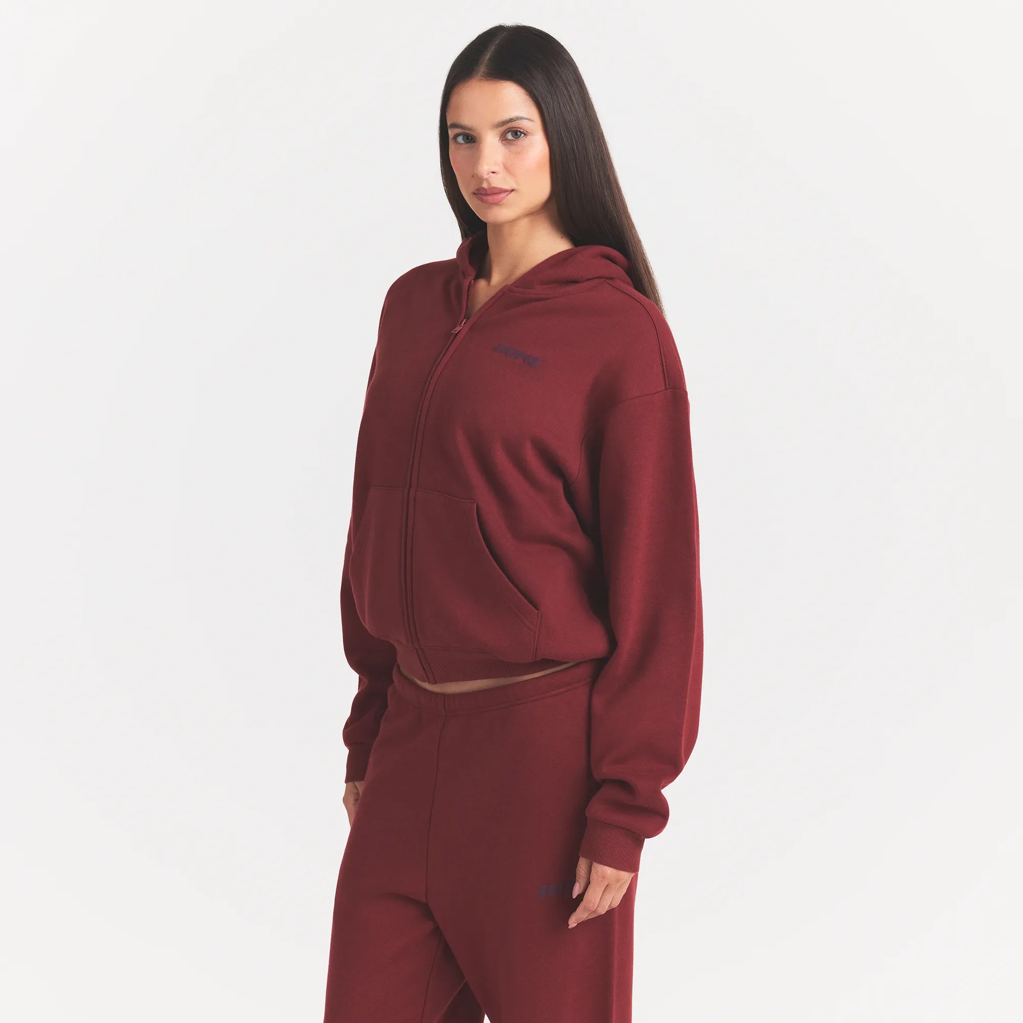 COTTON FLEECE CLASSIC ZIP UP HOODIE | MERLOT ON A MODEL SIDE VIEW @ | FOCUS: 0.0, 1.0, 0.9