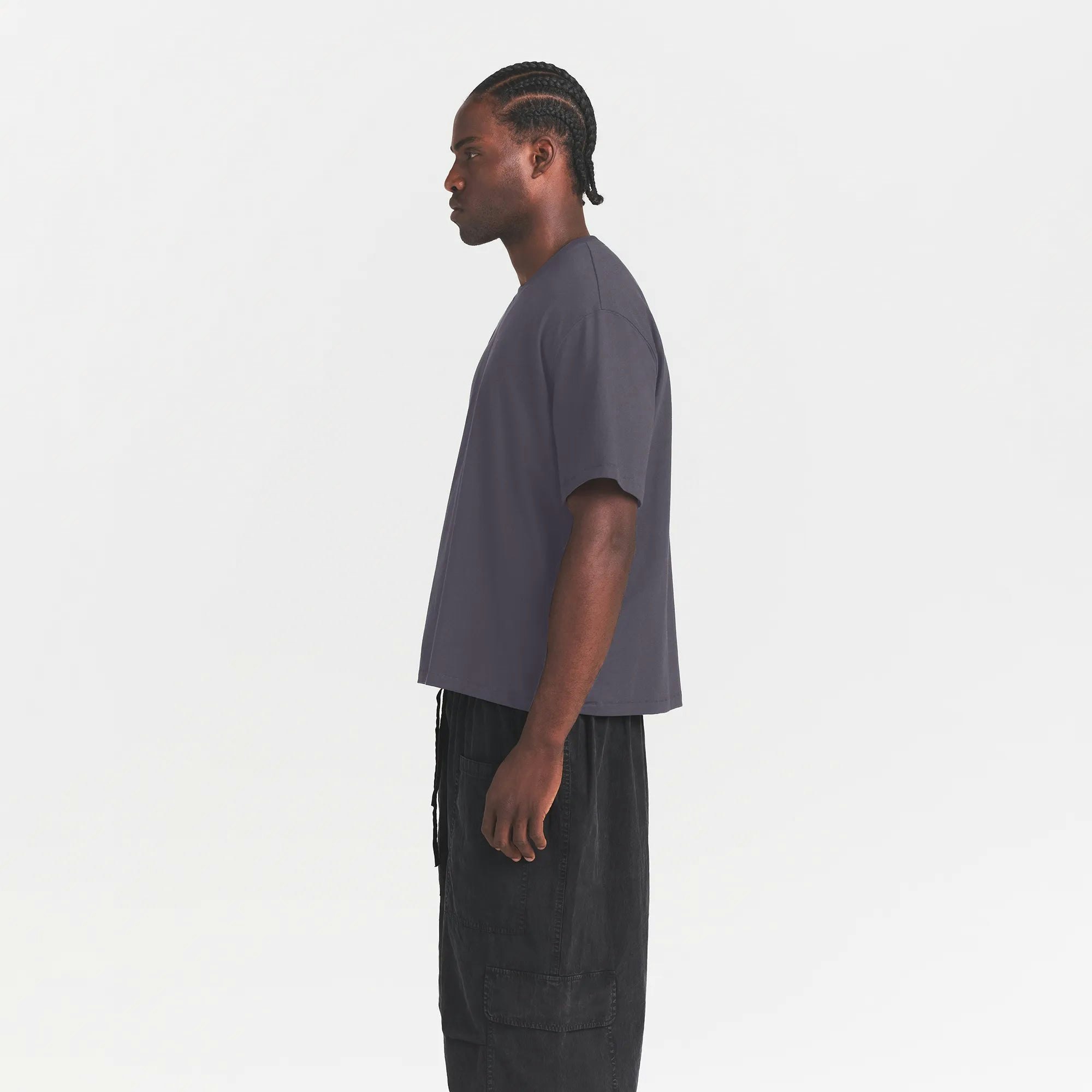 HEAVYWEIGHT COTTON MENS RELAXED CROPPED CREW NECK T-SHIRT | RAVEN ON A MODEL SIDE VIEW @ | FOCUS: 0.0, 1.0, 0.9