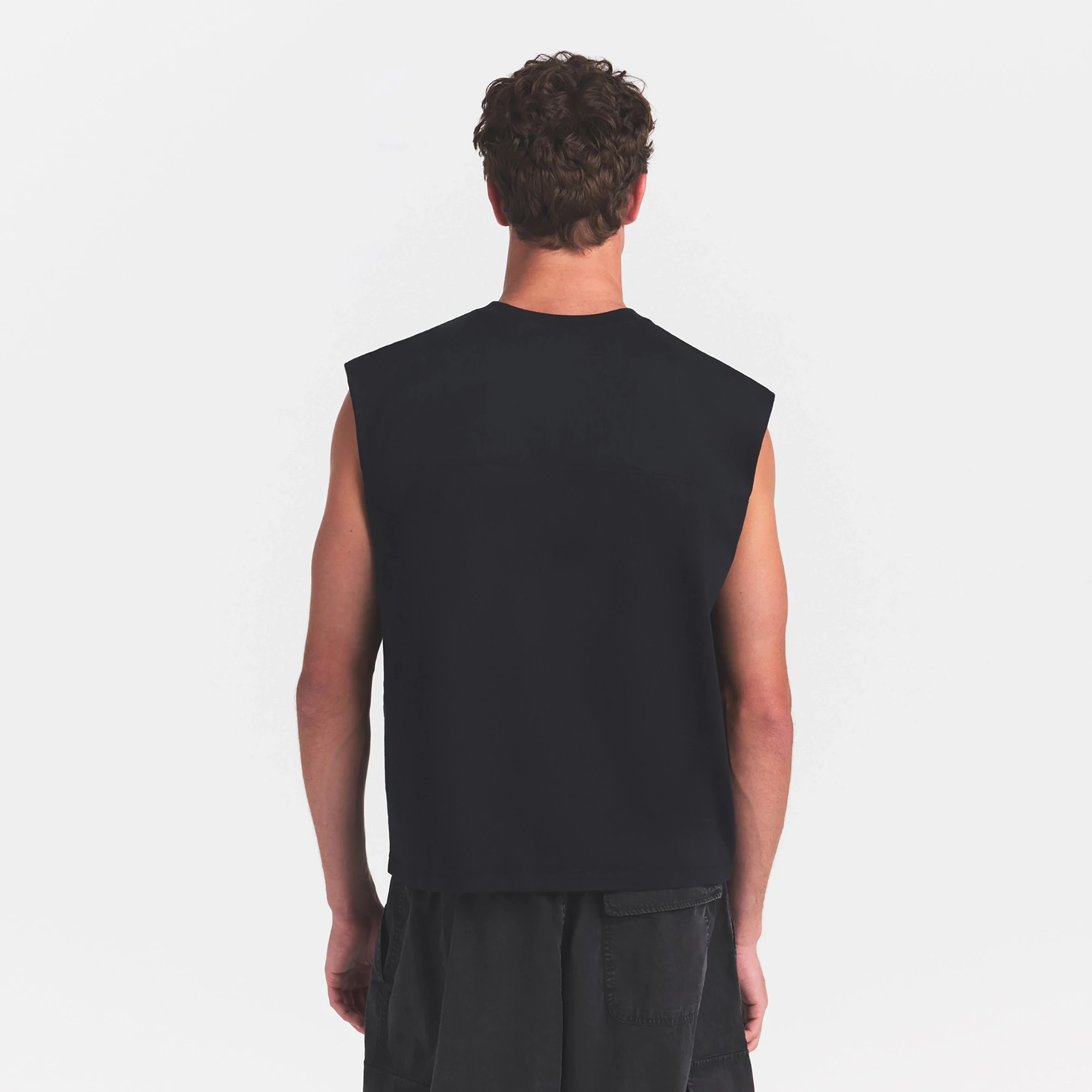 HEAVYWEIGHT COTTON MENS CROPPED MUSCLE TANK | OBSIDIAN ON A MODEL SIDE VIEW @ | FOCUS: 0.0, 1.0, 0.9