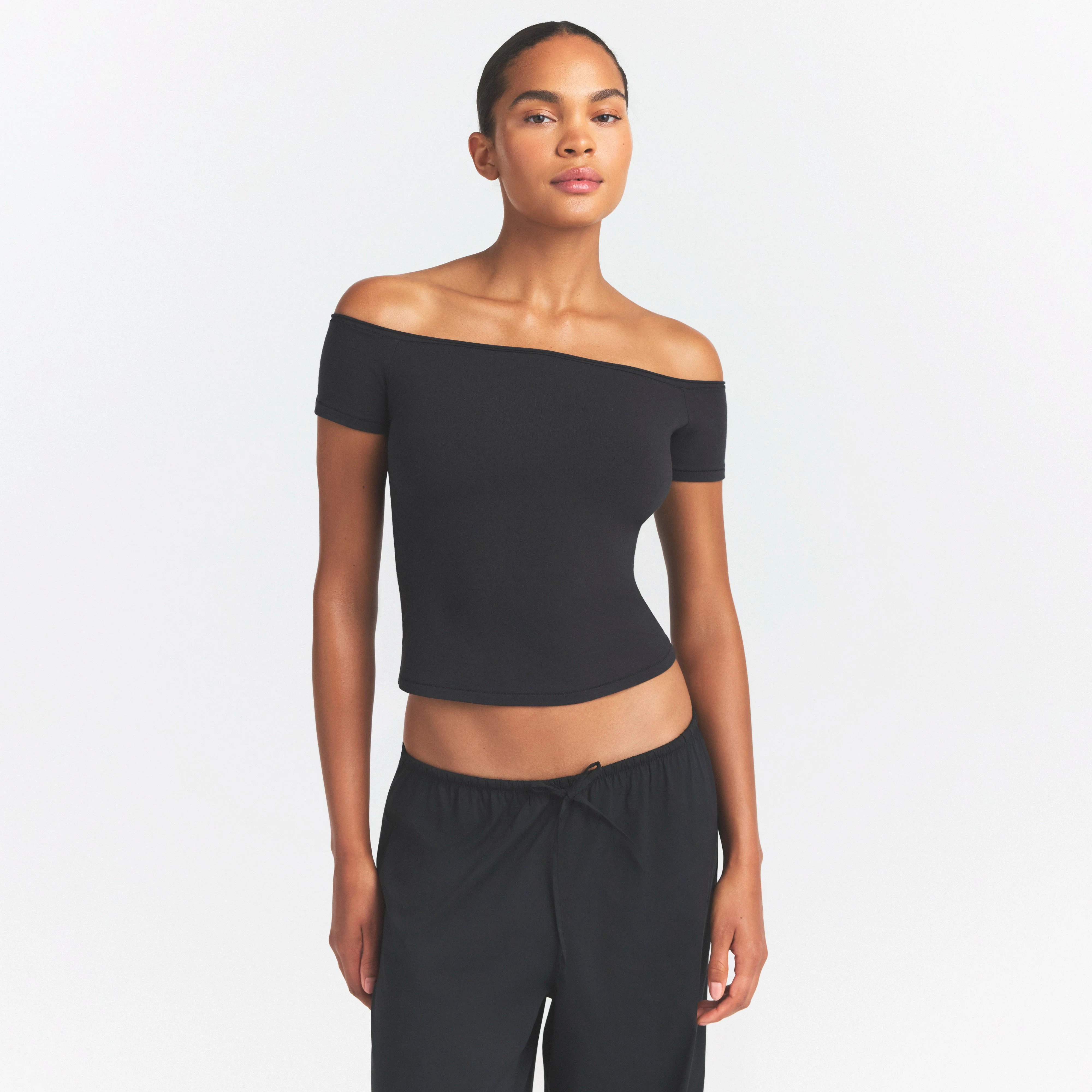 COTTON JERSEY OFF THE SHOULDER TOP | SOOT ON A MODEL SIDE VIEW @ | FOCUS: 0.0, 1.0, 0.9