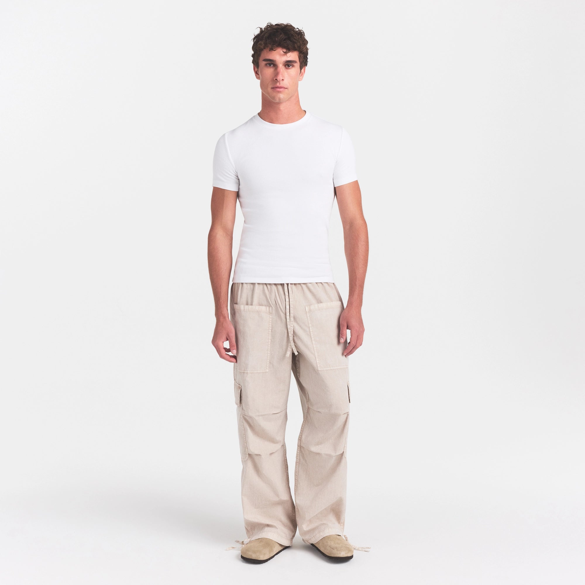 SKIMS COTTON RIB MENS T-SHIRT | CHALK ON A MODEL FRONT VIEW @ | FOCUS: 0.0, 1.0, 0.9