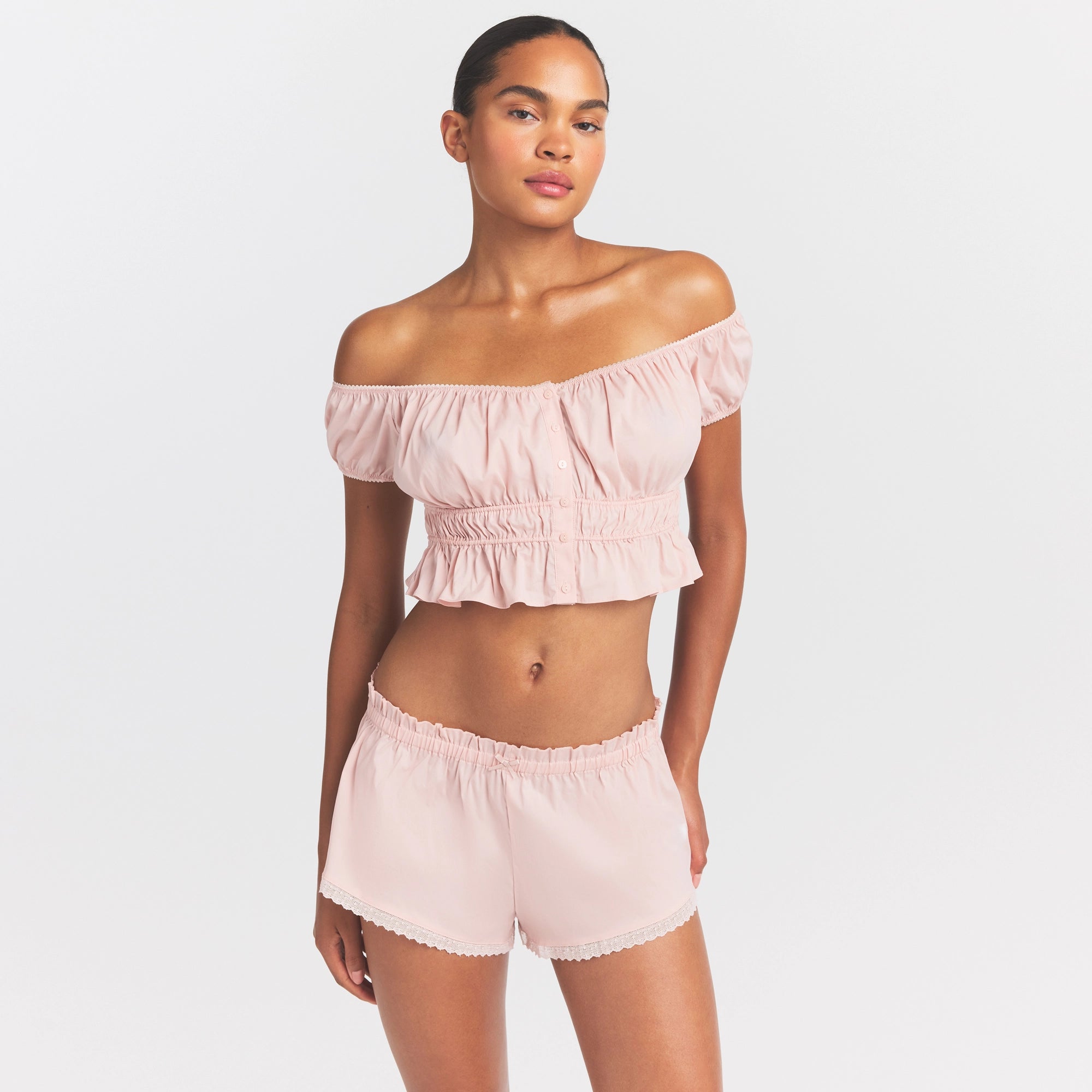COTTON POPLIN OFF THE SHOULDER TOP | DUSTY PINK ON A MODEL SIDE VIEW @ | FOCUS: 0.0, 1.0, 0.9