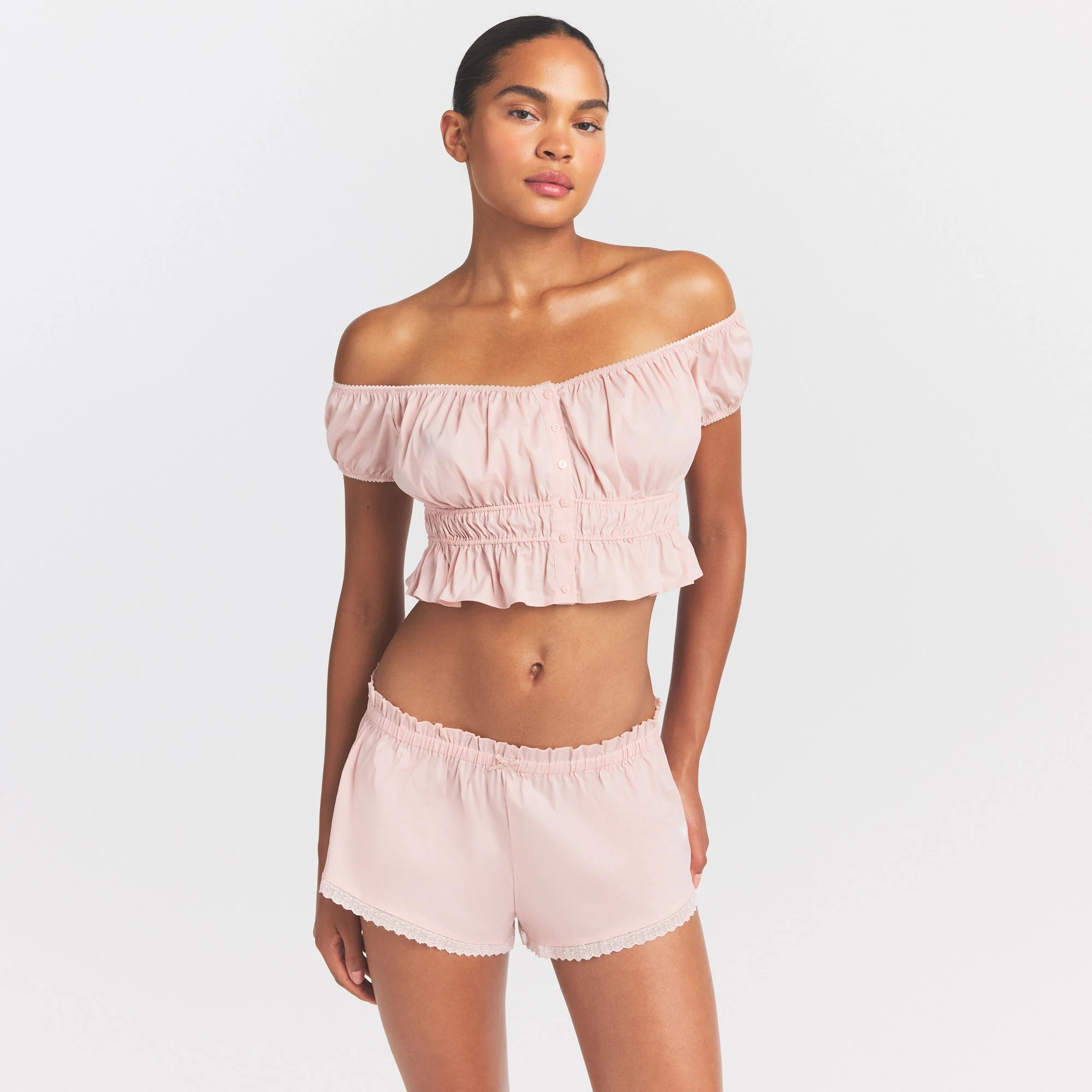 COTTON POPLIN OFF THE SHOULDER TOP | DUSTY PINK ON A MODEL SIDE VIEW @ | FOCUS: 0.0, 1.0, 0.9