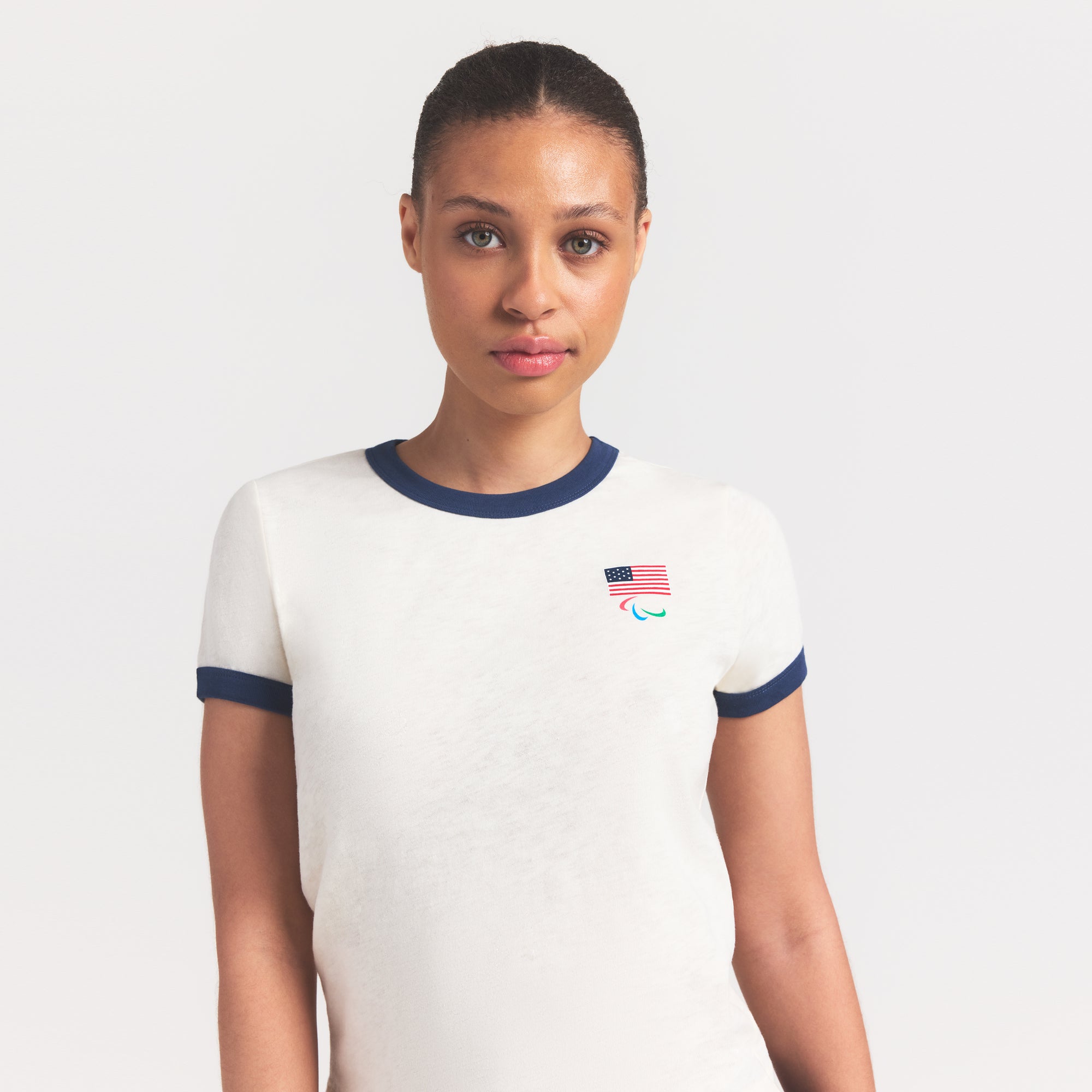 SKIMS FOR TEAM USA WORN IN JERSEY PARALYMPIC SHRUNKEN T-SHIRT | ECRU ON A MODEL SIDE VIEW @ | FOCUS: 0.0, 1.0, 0.9